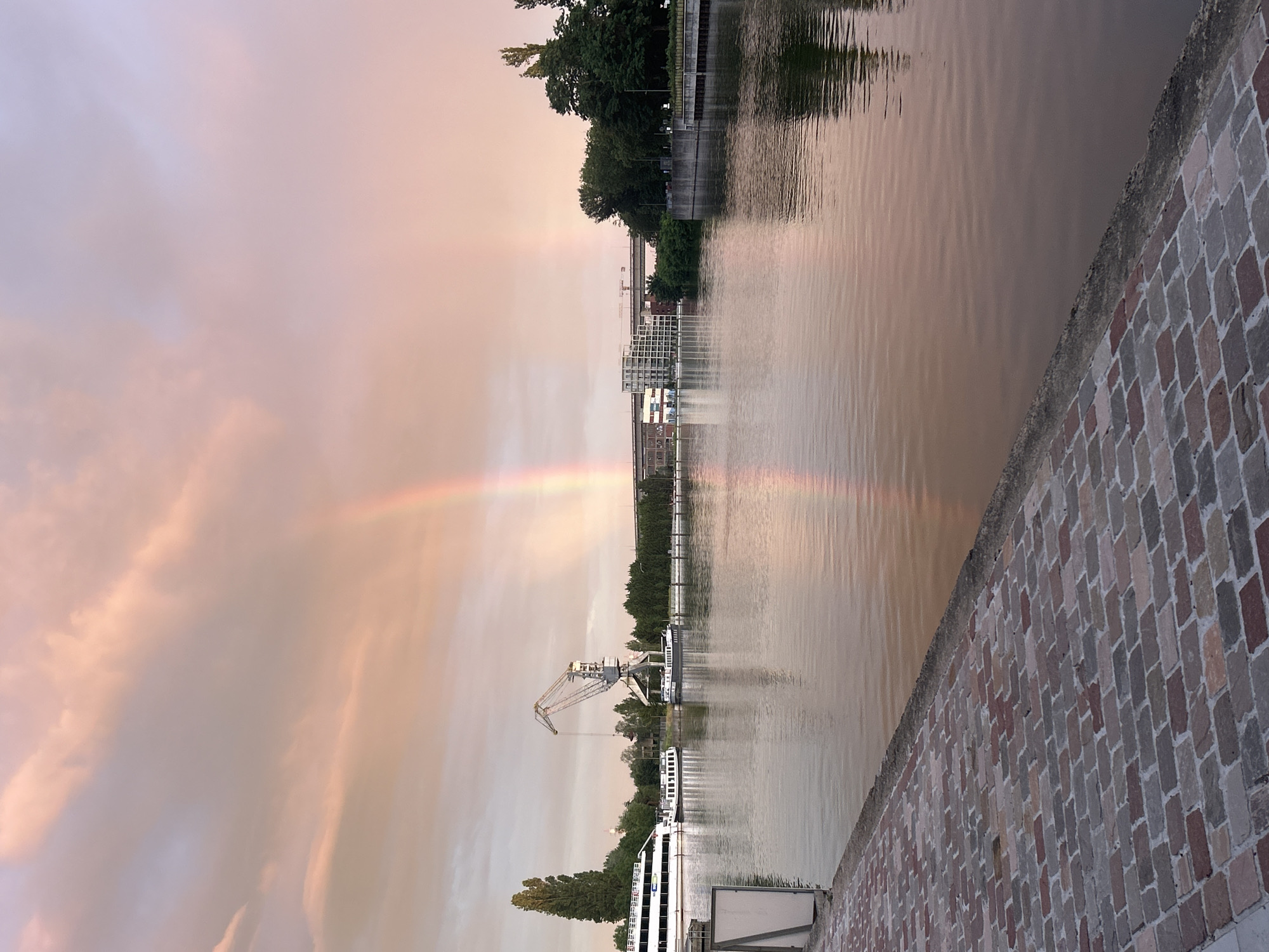 Double rainbow over Vilvoorde canal at golden hour