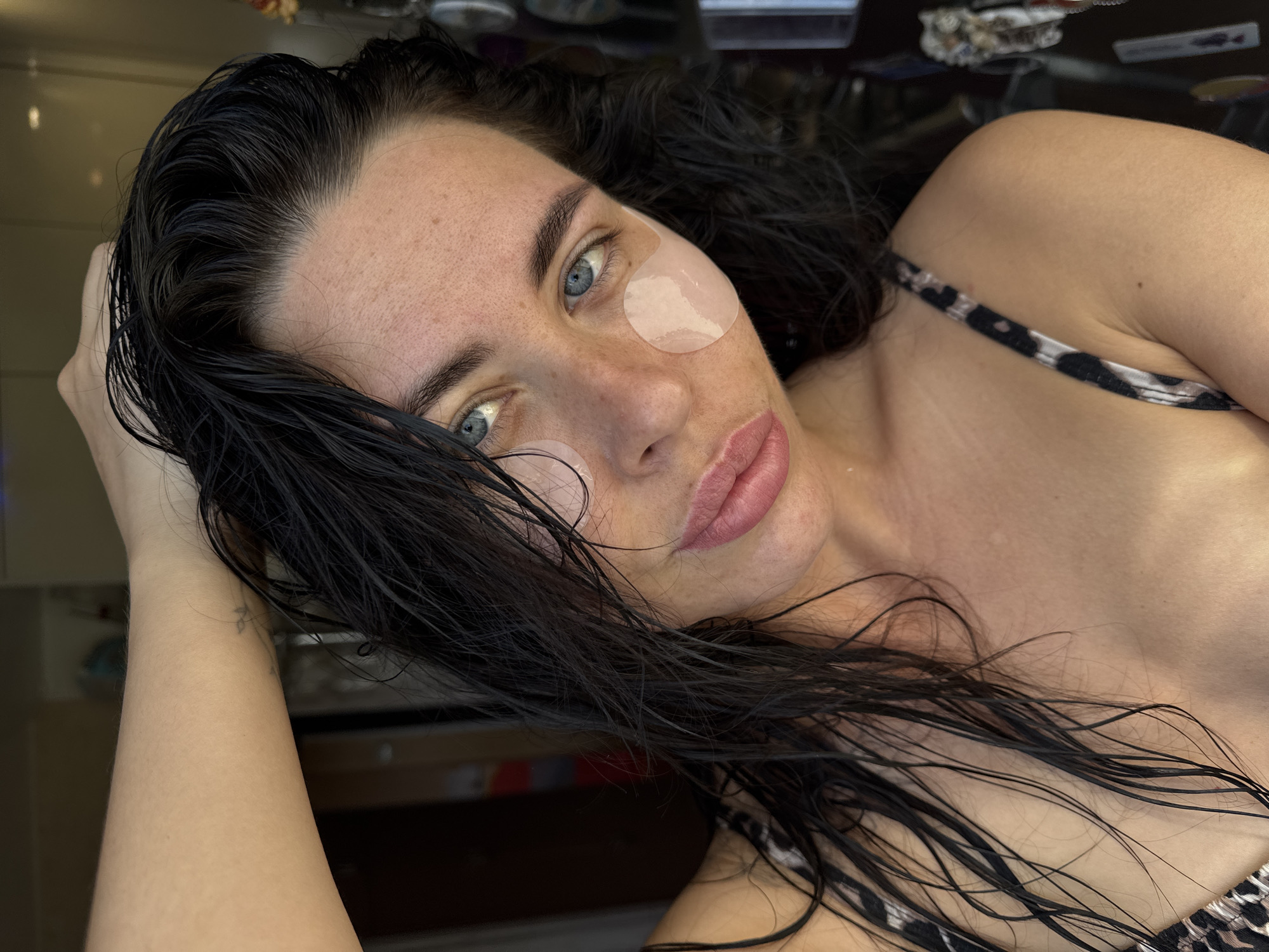 Woman photographed in bed during early morning hours in Chaikovsky