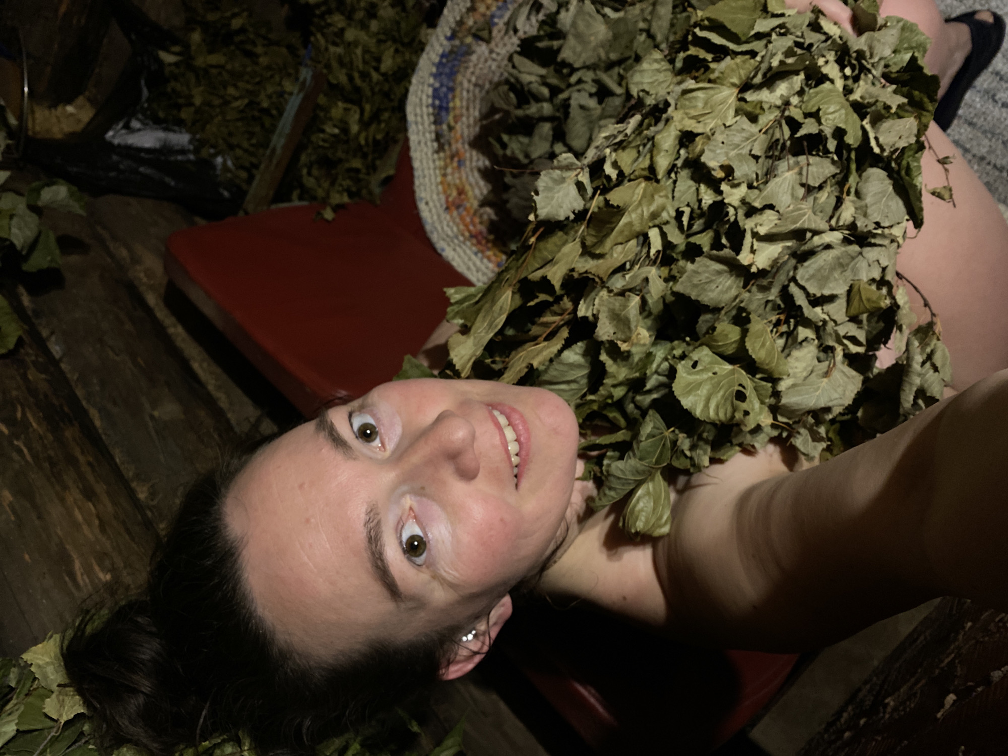 Woman enjoys traditional Russian sauna experience in Noviy