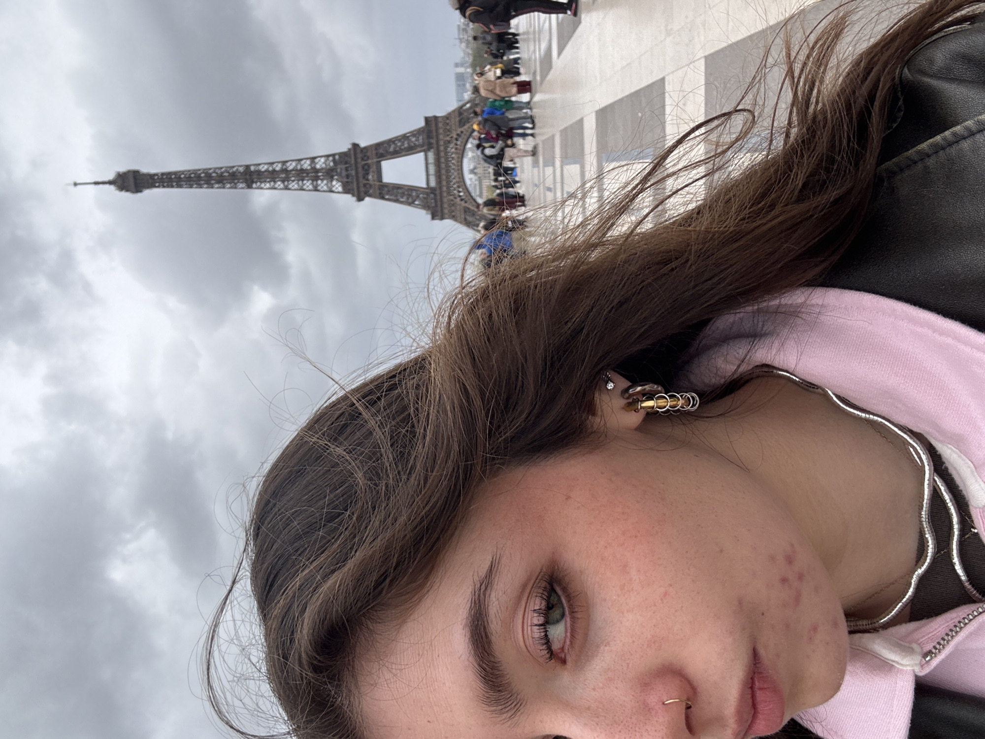 Tourist enjoys classic Paris café experience near Eiffel Tower