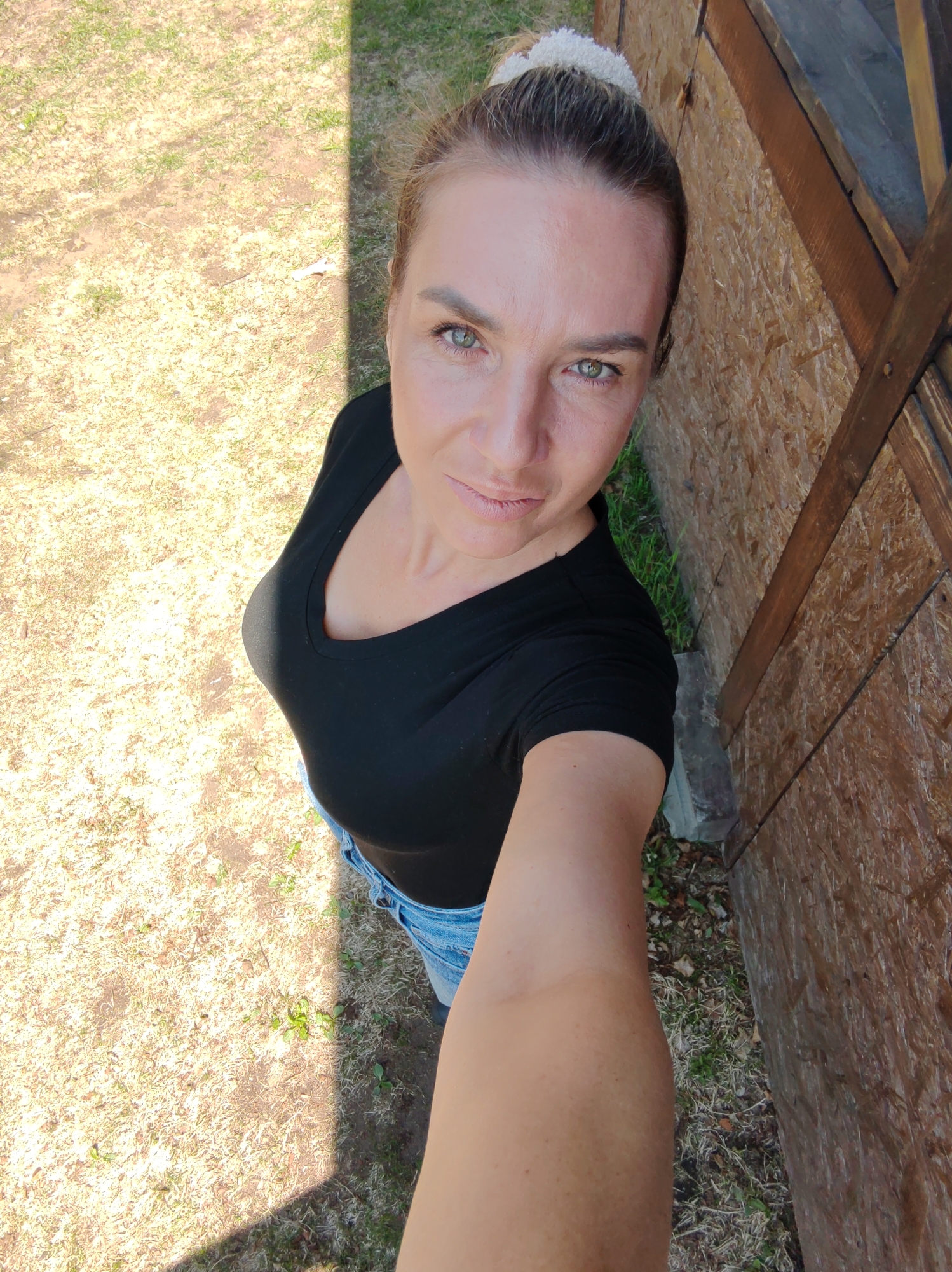 Woman documents rural backyard activities in unidentified location