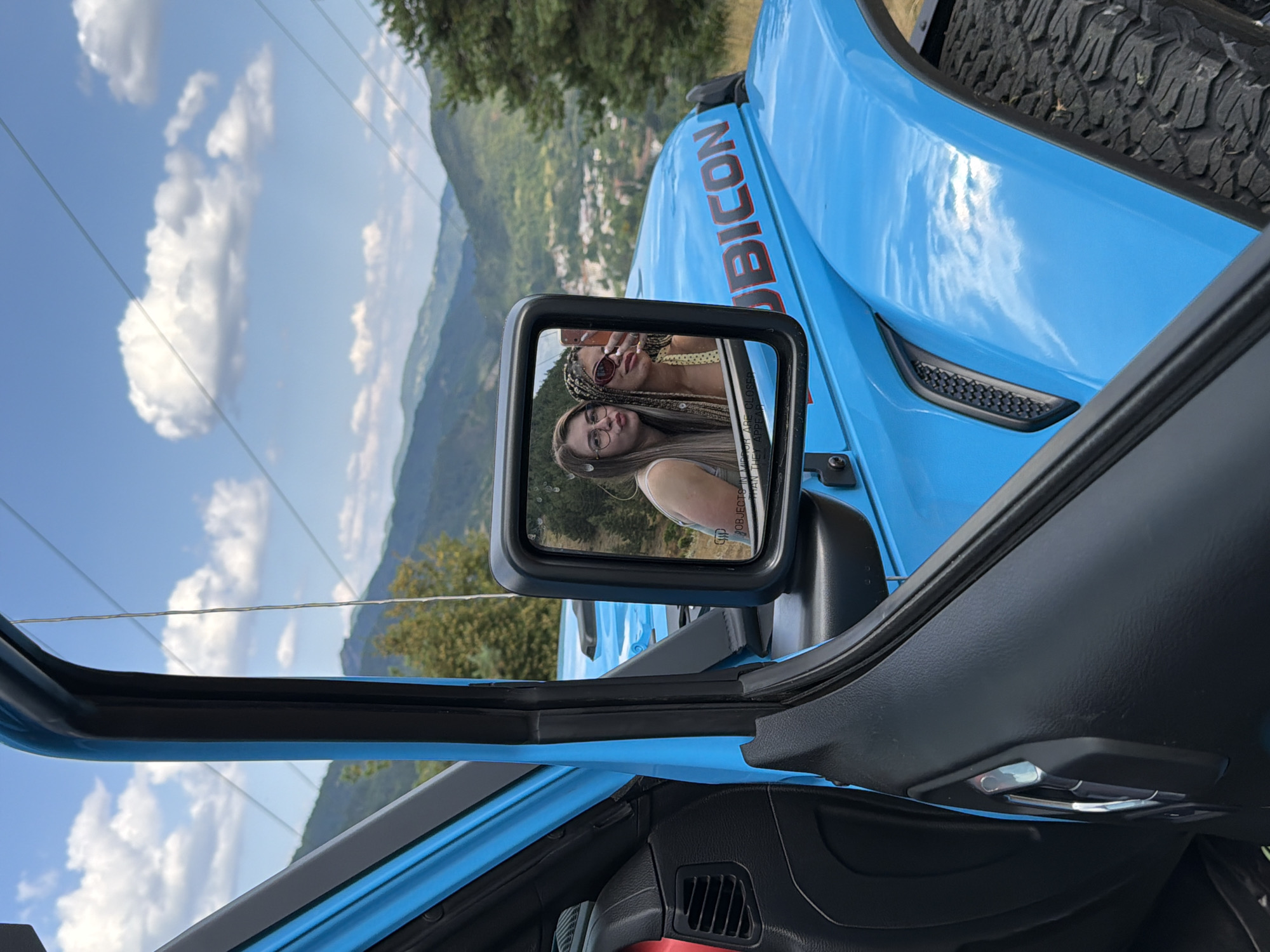 Roadside stop above Smolyan with valley views and a blue Jeep