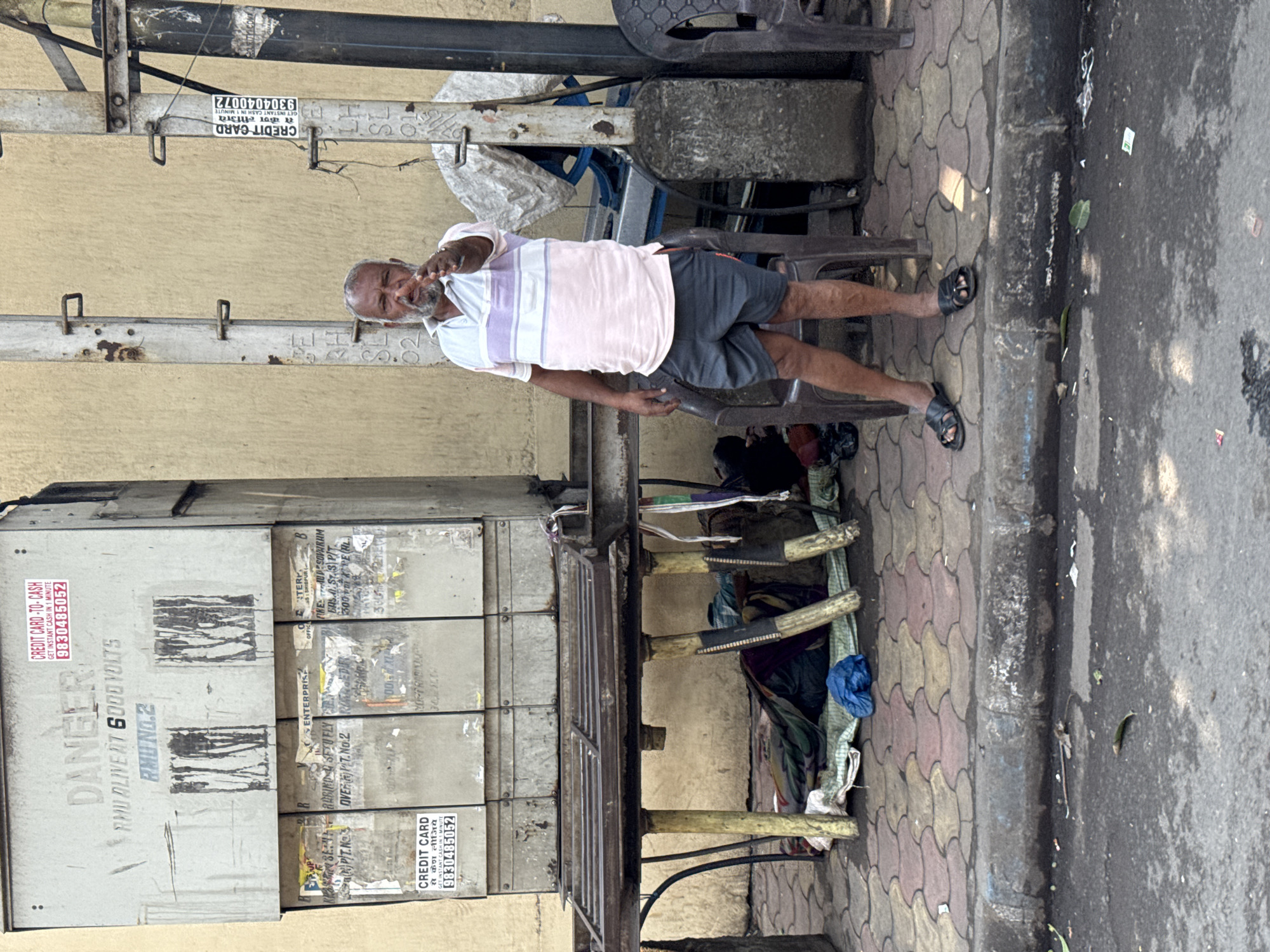 Kolkata street workers loading cargo trucks in commercial district