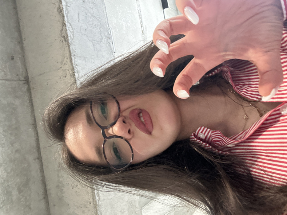 Woman Takes Indoor Selfies in Zovuni, Armenia