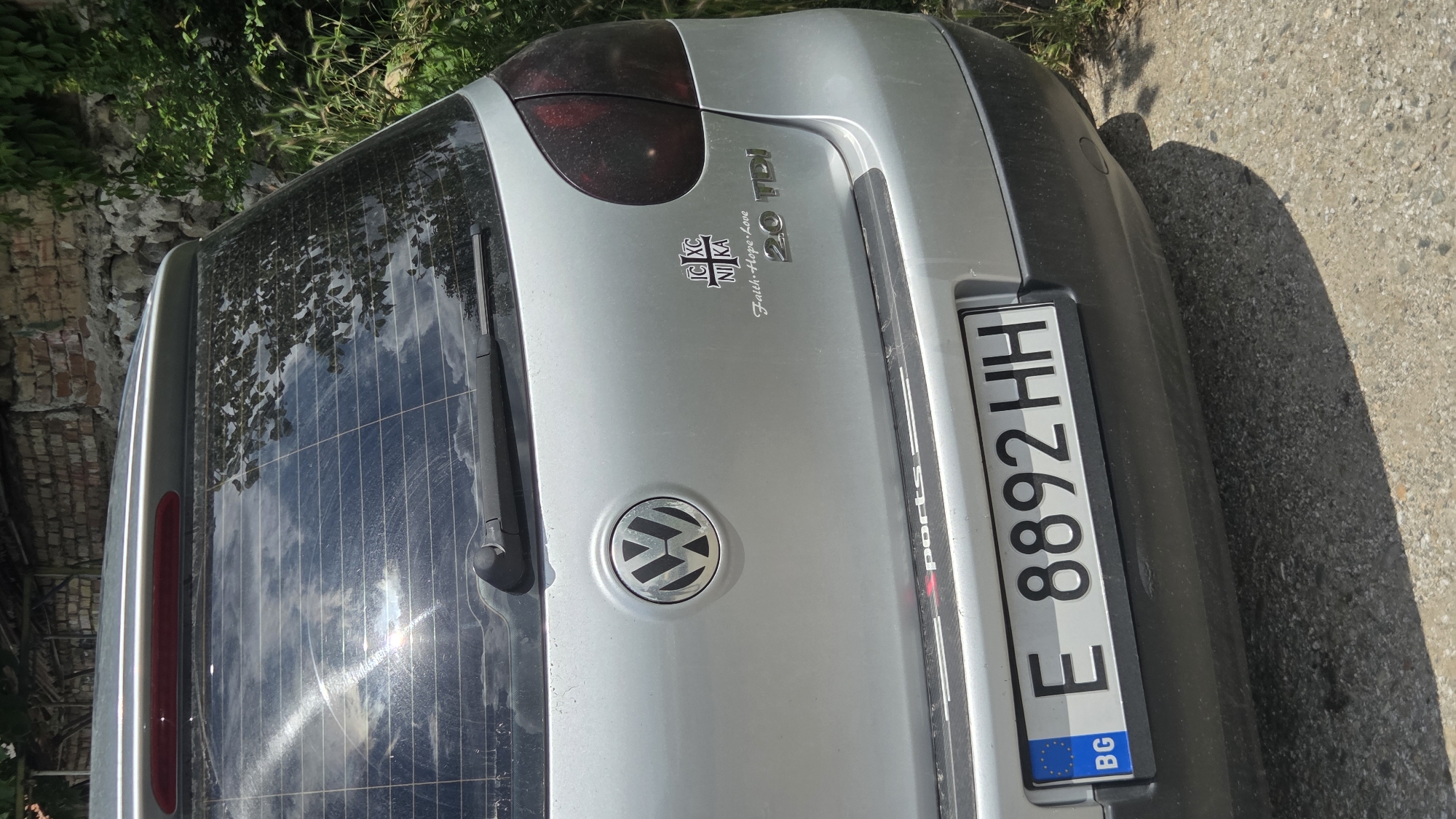 Quiet morning errands around a village, Volkswagen Golf in tow