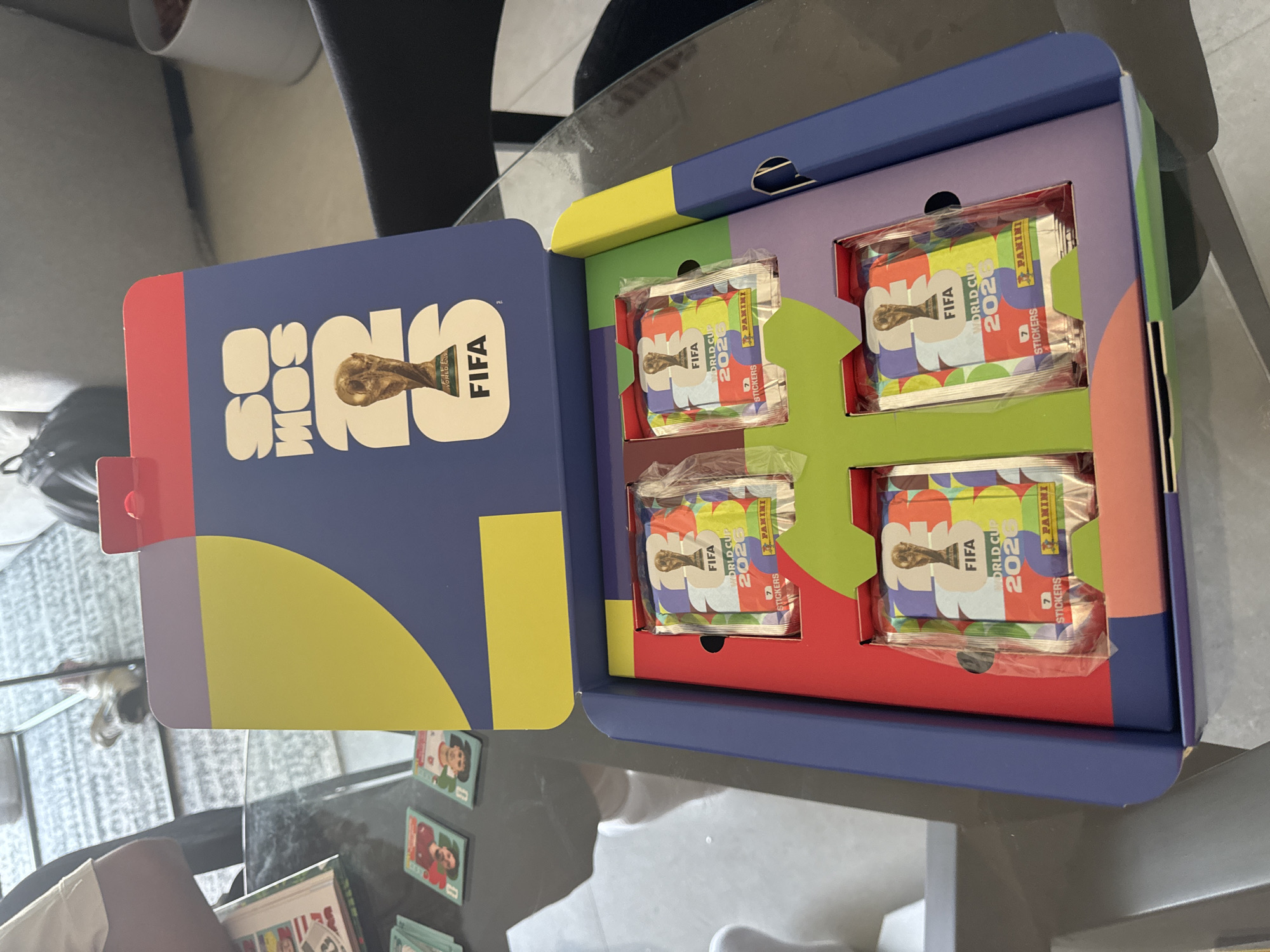 Soccer fan opens World Cup sticker packs in León