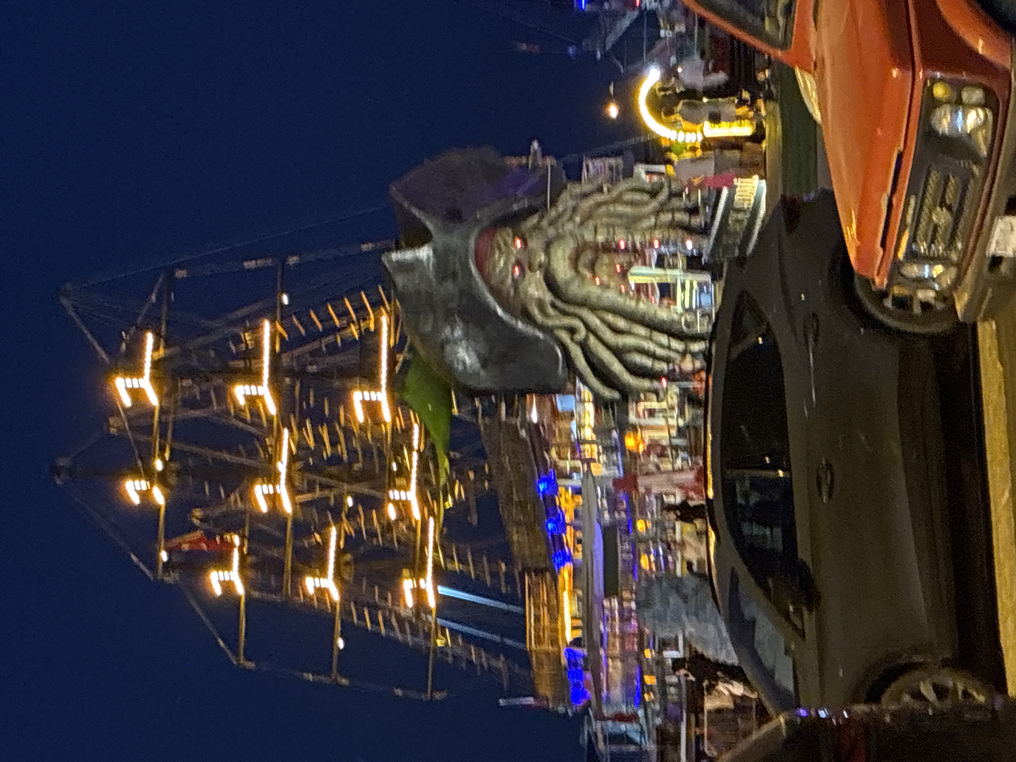 Alanya's waterfront at night: pirate ship, restaurants, and waterfalls