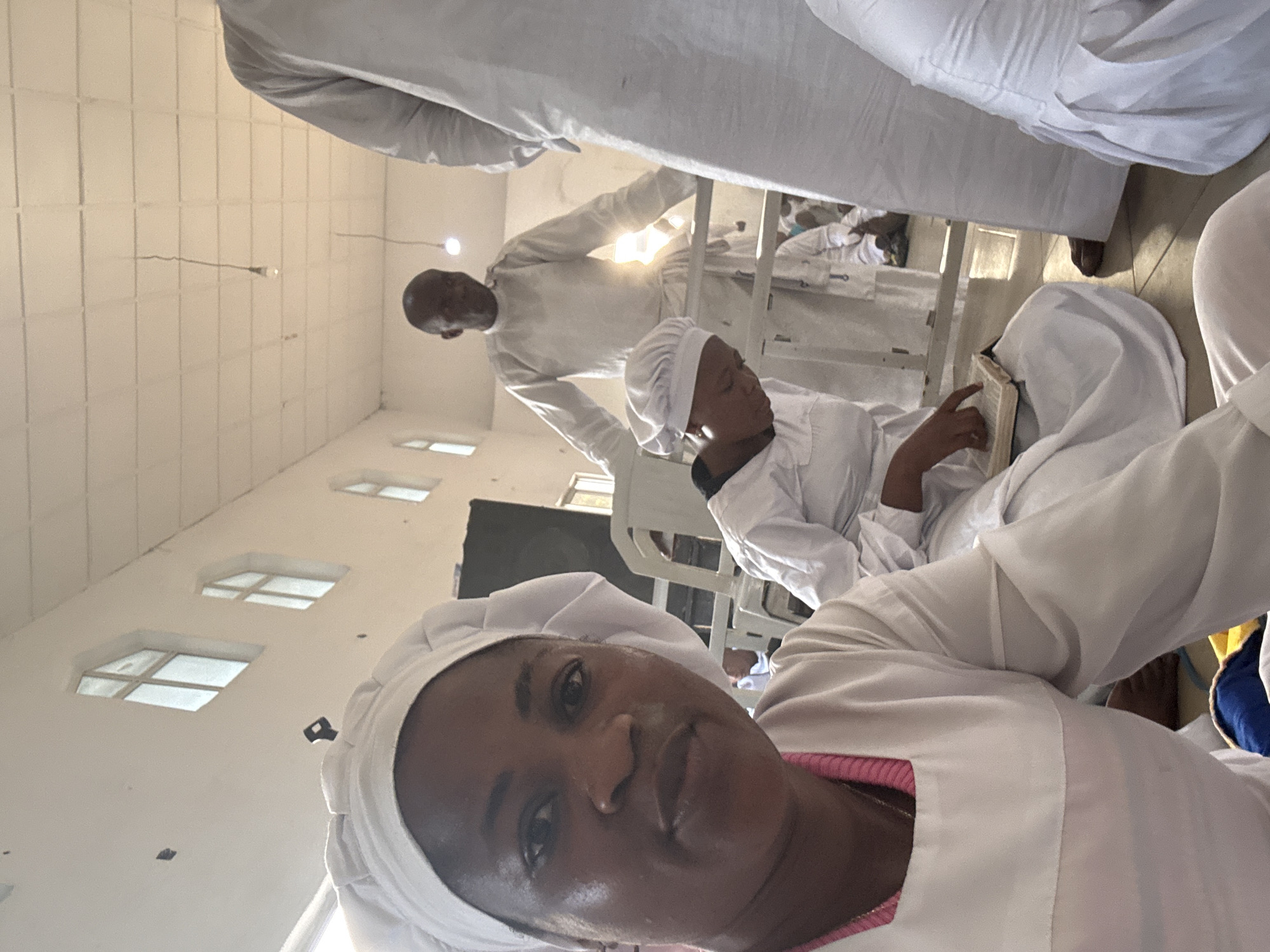 White-robed group gathers in church interior, selfie taken