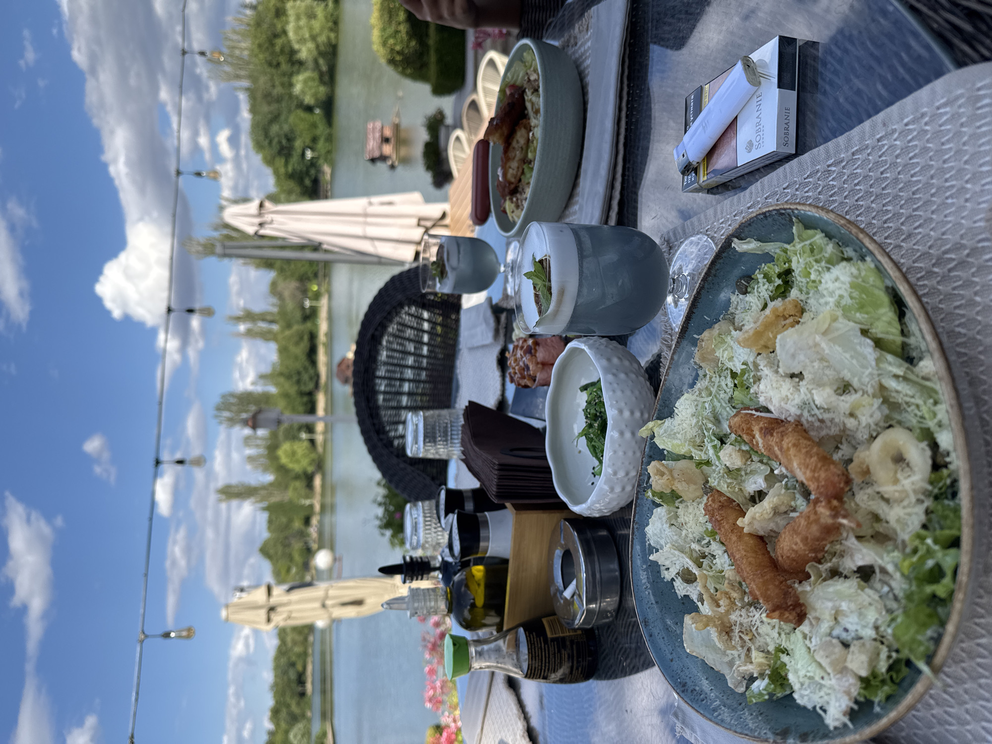 Waterside lunch spread with cocktails and sushi in Bulgaria