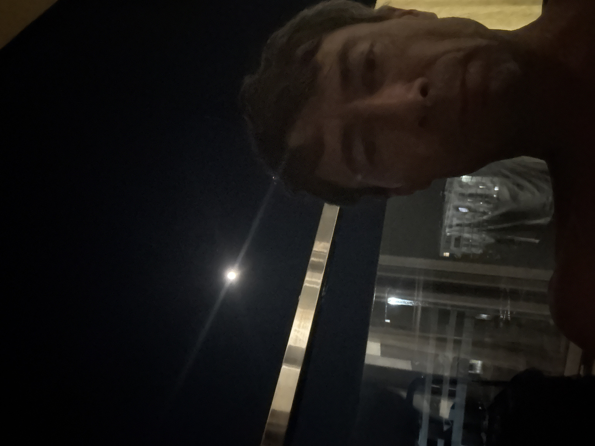 Moonlit night in Boreti with a blue-lit water feature nearby