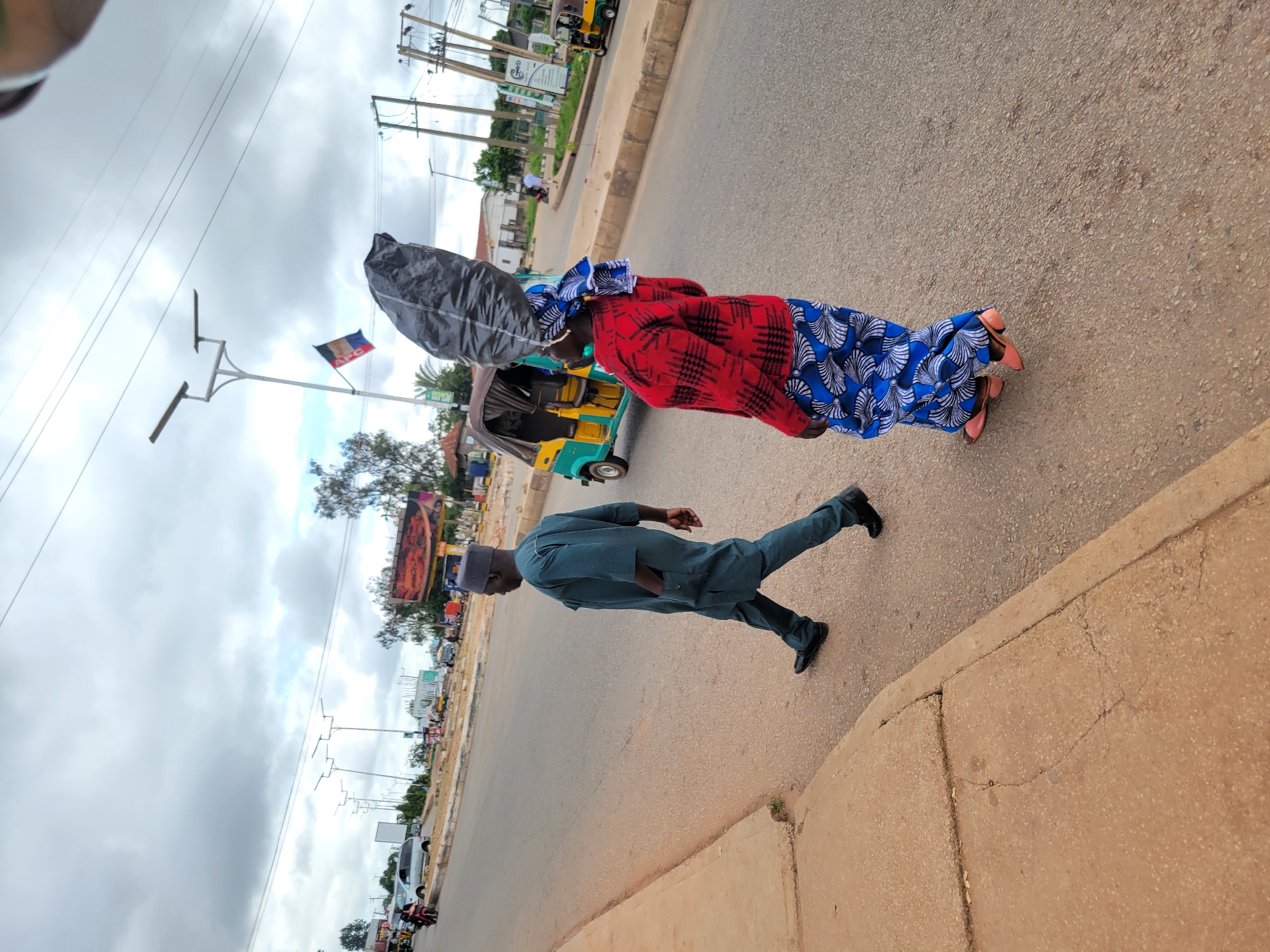 Morning street life and construction activity in Jos, Nigeria