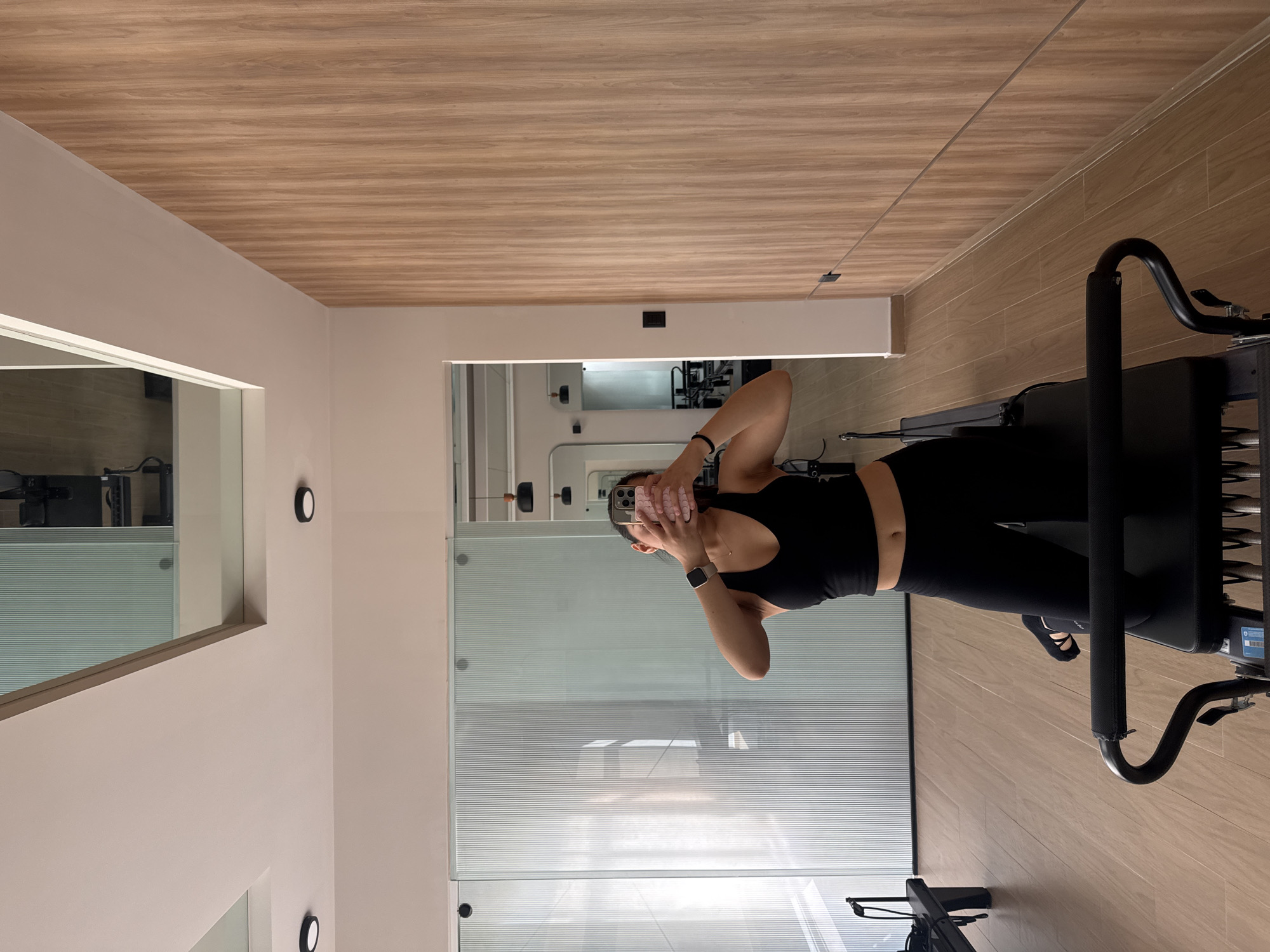 Woman takes mirror selfie at Mexico fitness studio