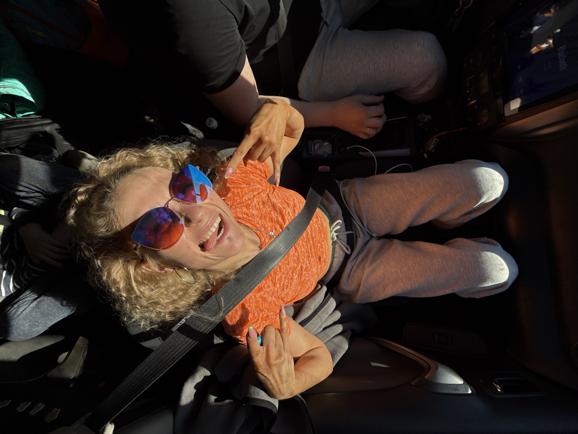 Woman in orange shirt observed in car in Chaikovsky