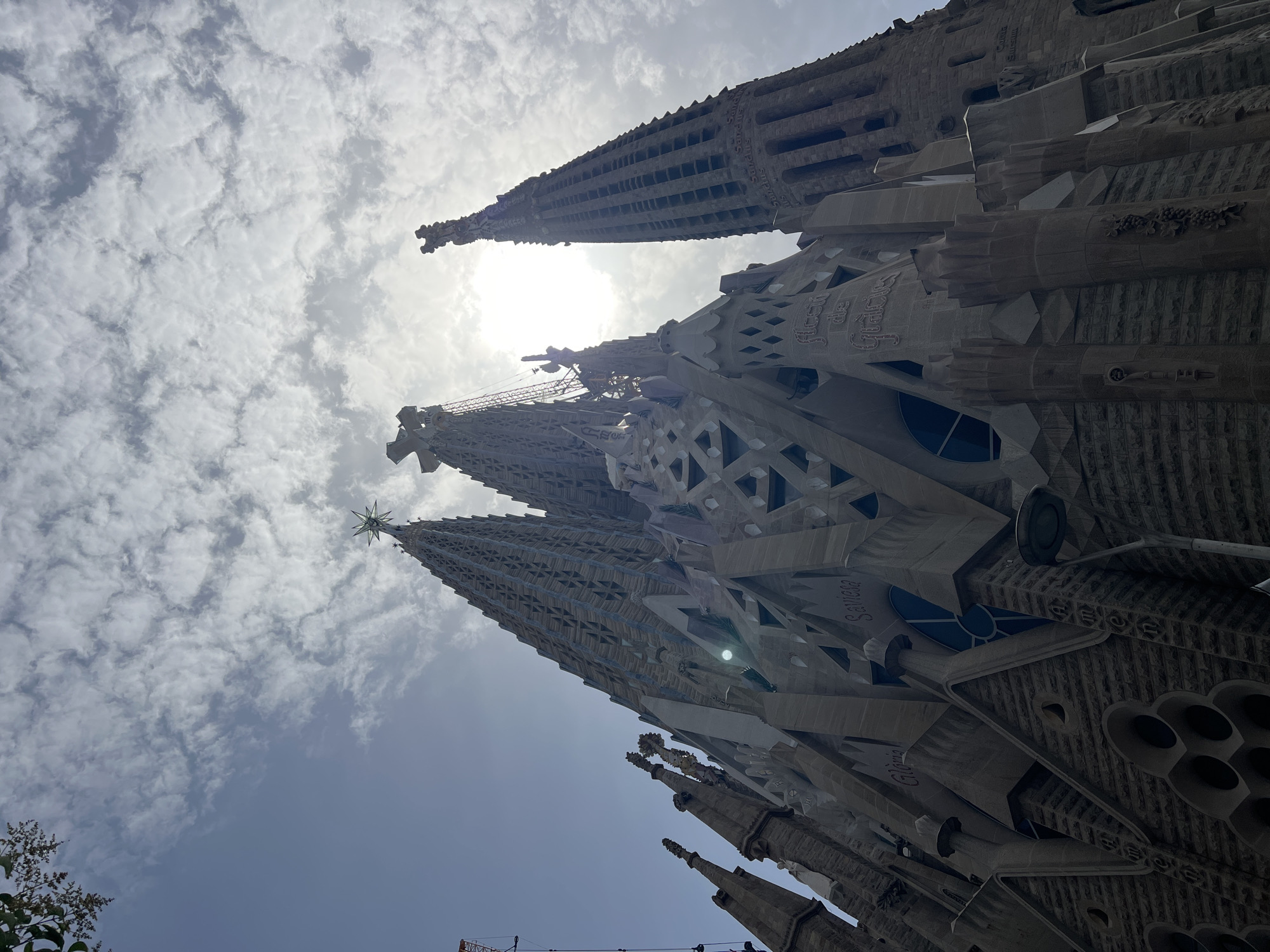 Sagrada Família spires and street music on a Barcelona morning