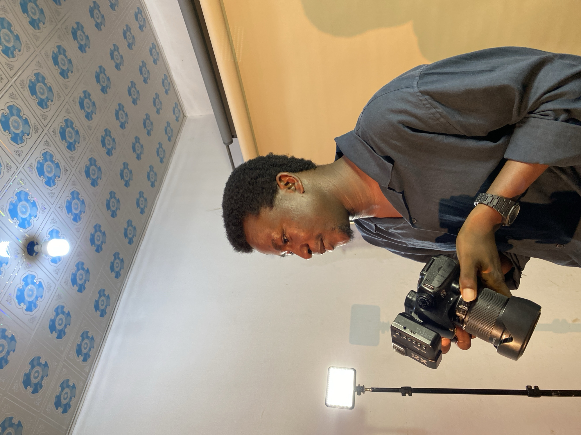 Portrait photography session in makeshift studio, Gura Top Nigeria