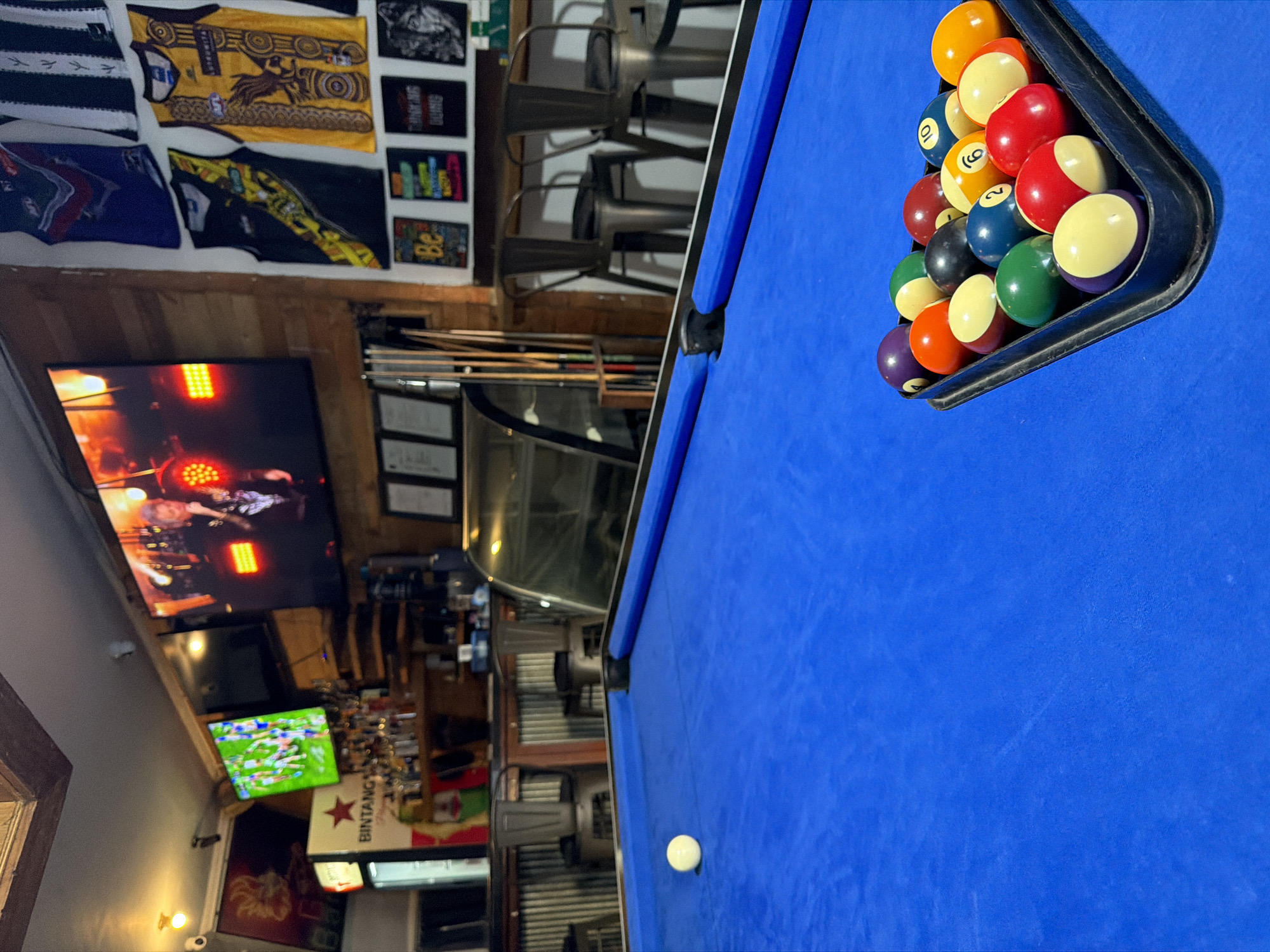 Kuta bar interior with pool table and batik décor
