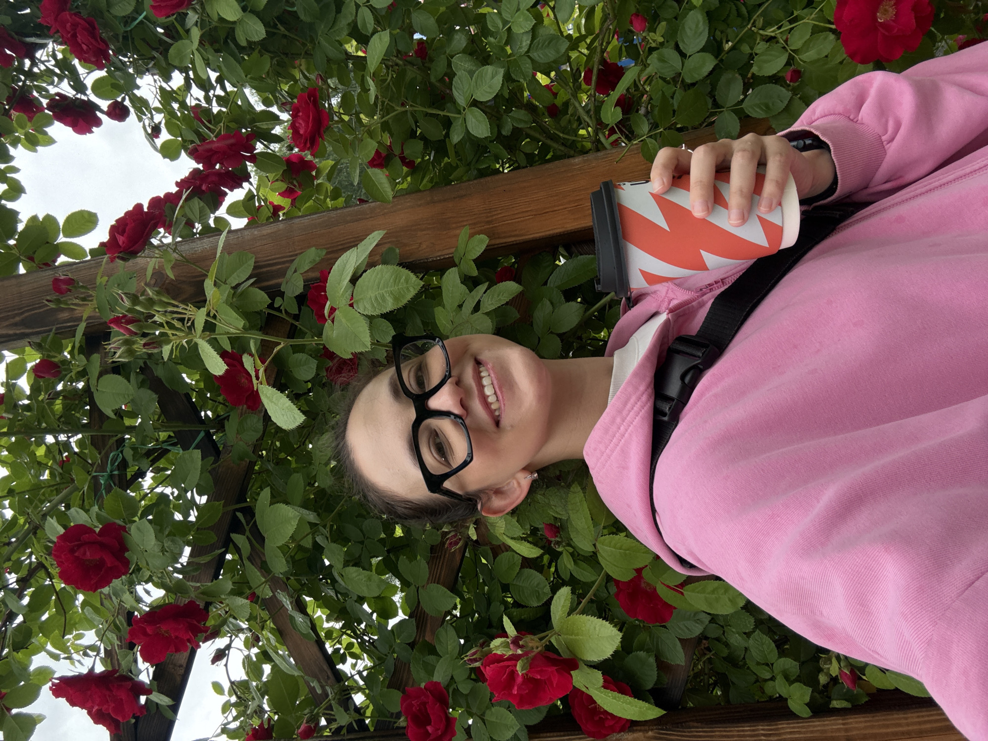 Coffee and roses at a pergola in Chaikovsky, summer morning