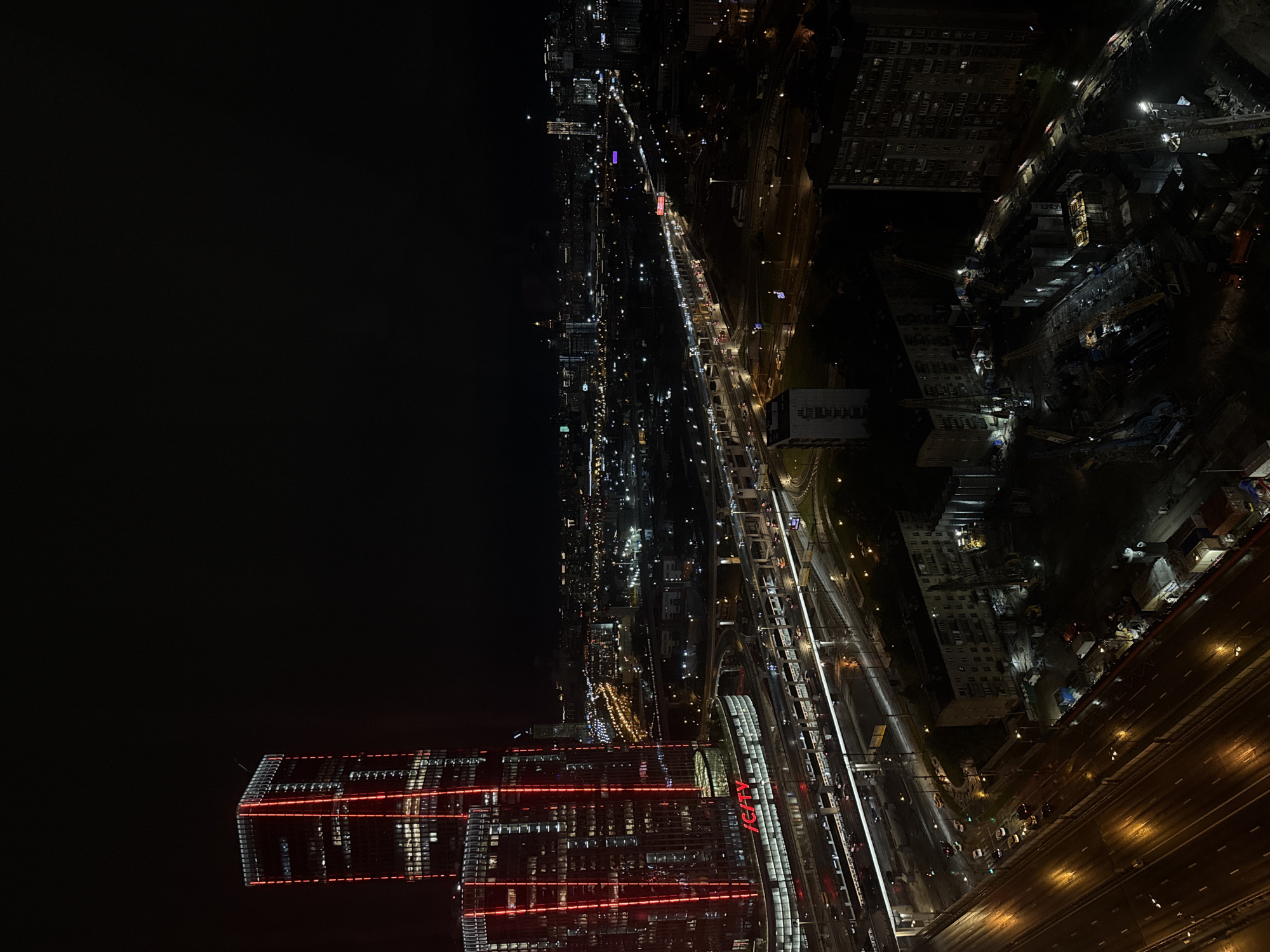 Nighttime cityscape observed from elevated vantage point