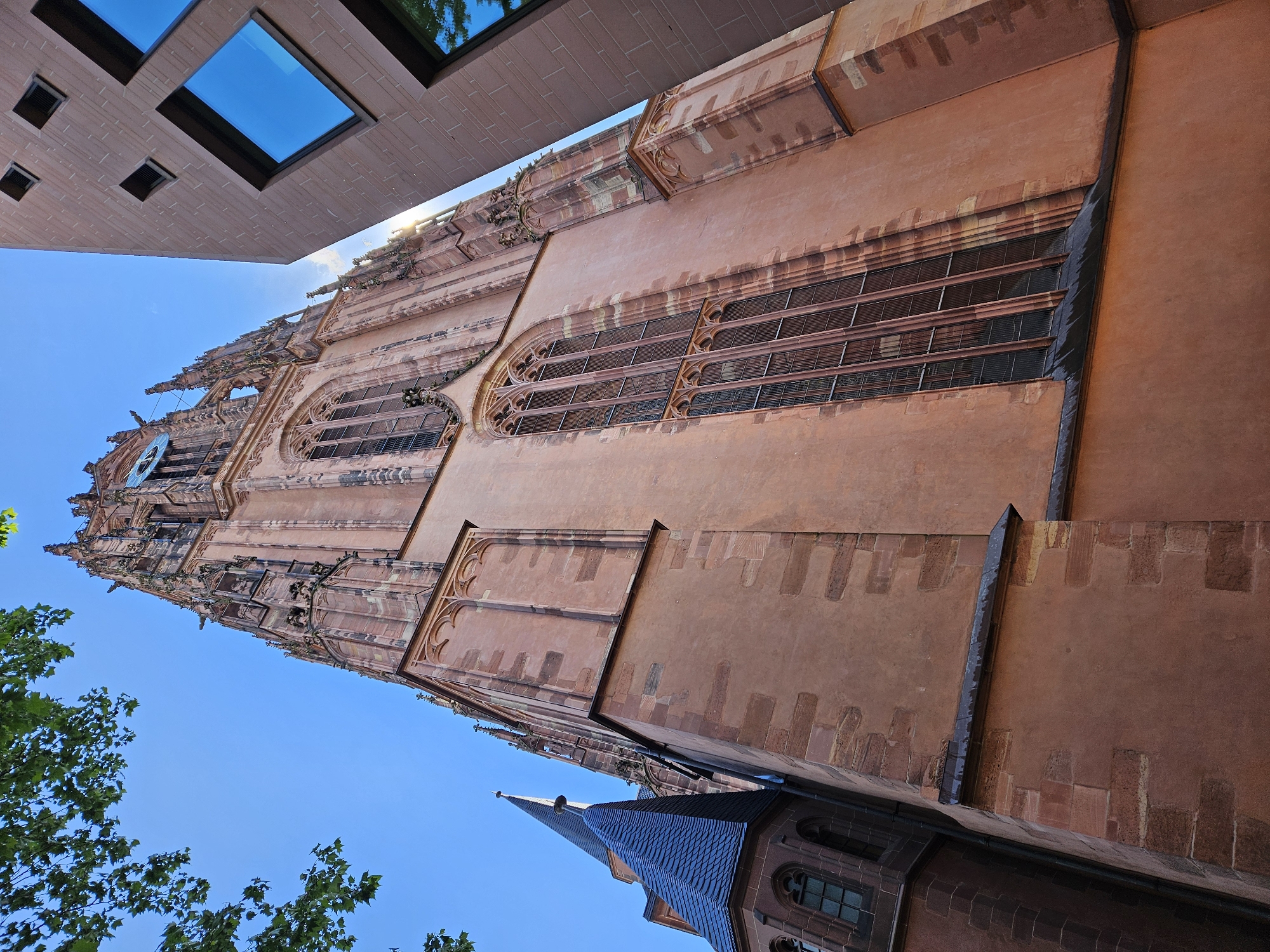 Frankfurt Cathedral photographed from low angle amid modern architecture