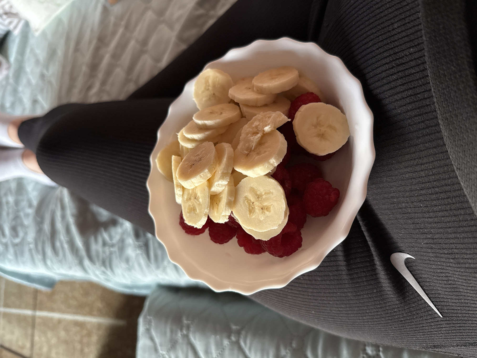 Person enjoys fruit bowl snack in Sofia apartment