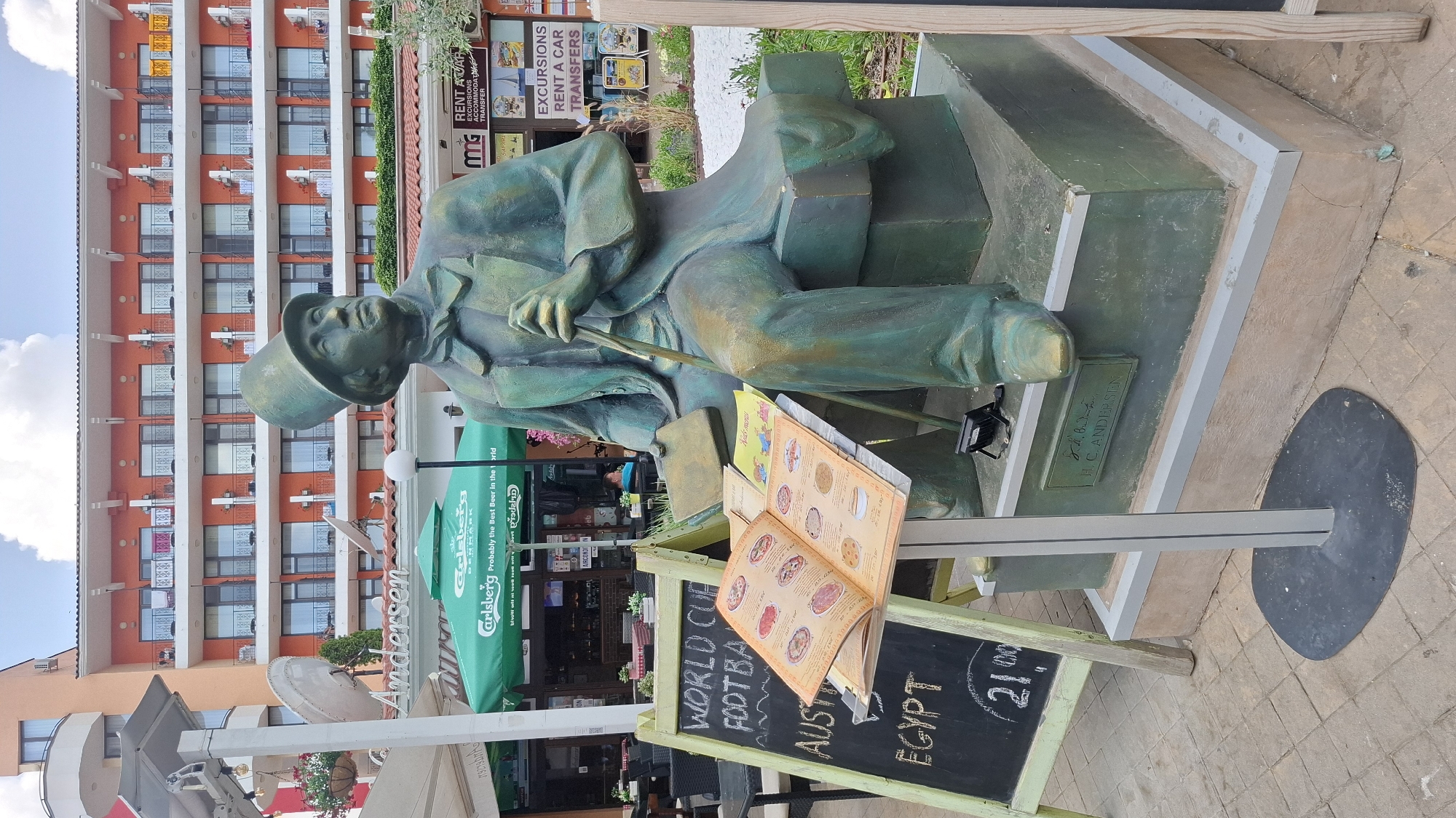 Summer morning around a Nesebar resort: statues, seagulls, and garden scenes