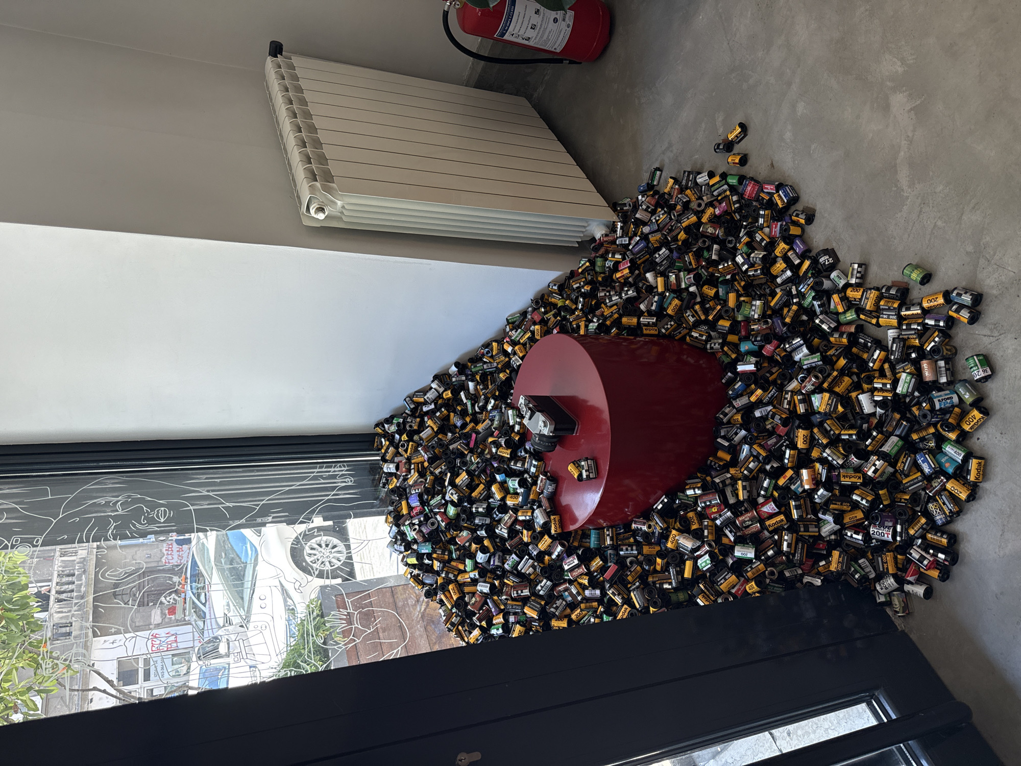 Film canister art installation documented in Belgrade street scenes
