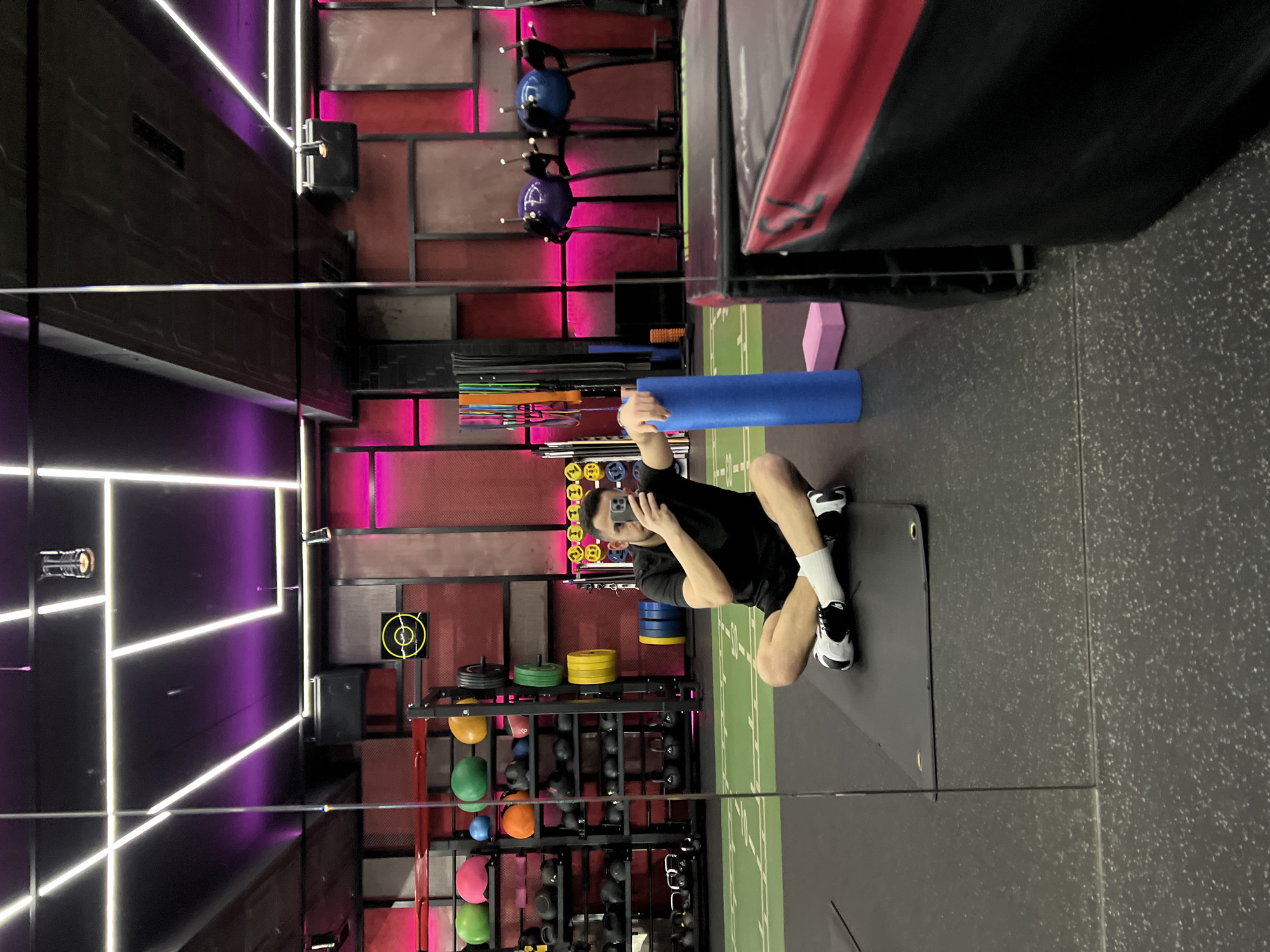 Person exercises with foam roller at Sofia fitness facility