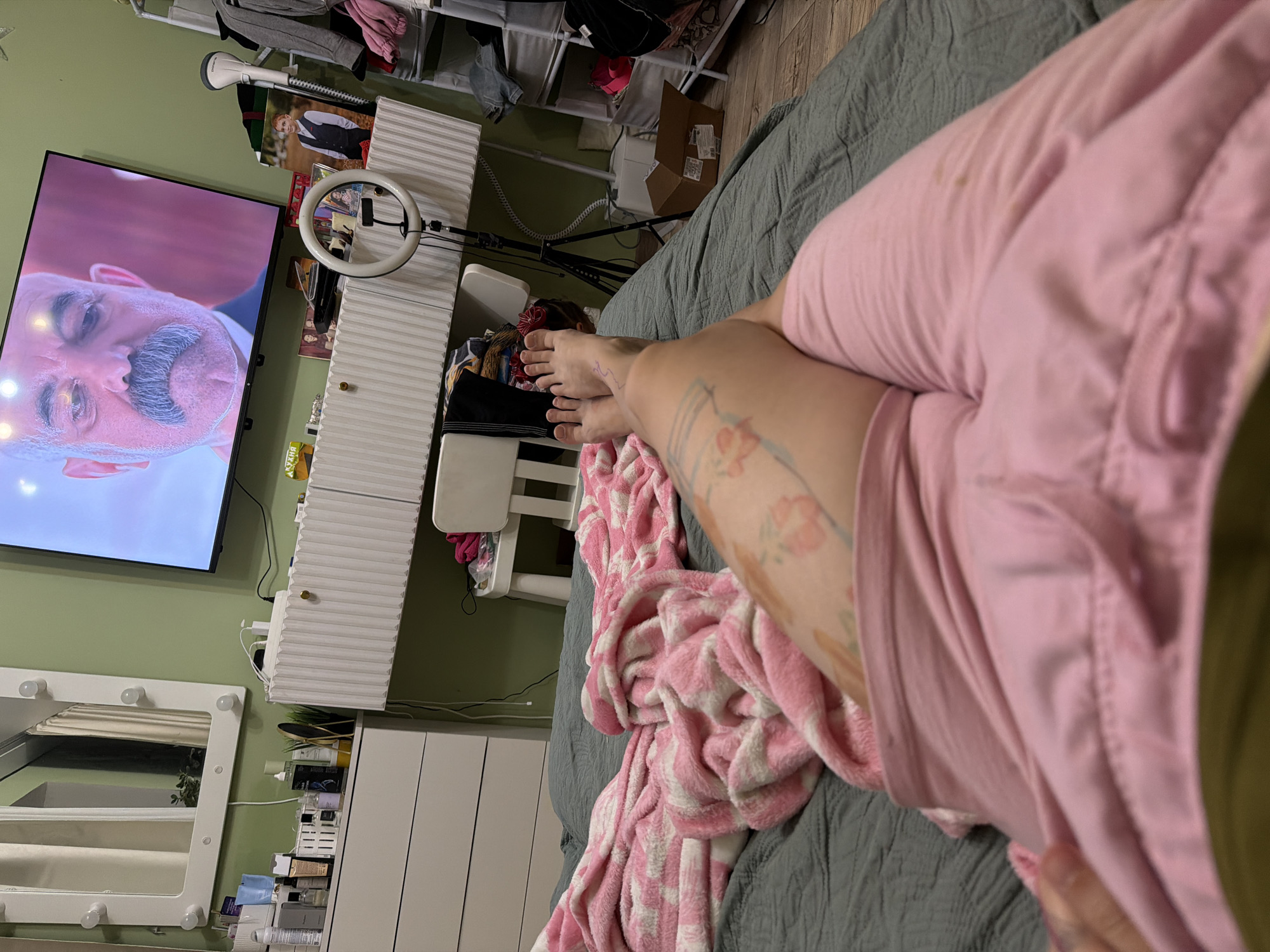 Evening TV time in a green-walled bedroom, Zavetny