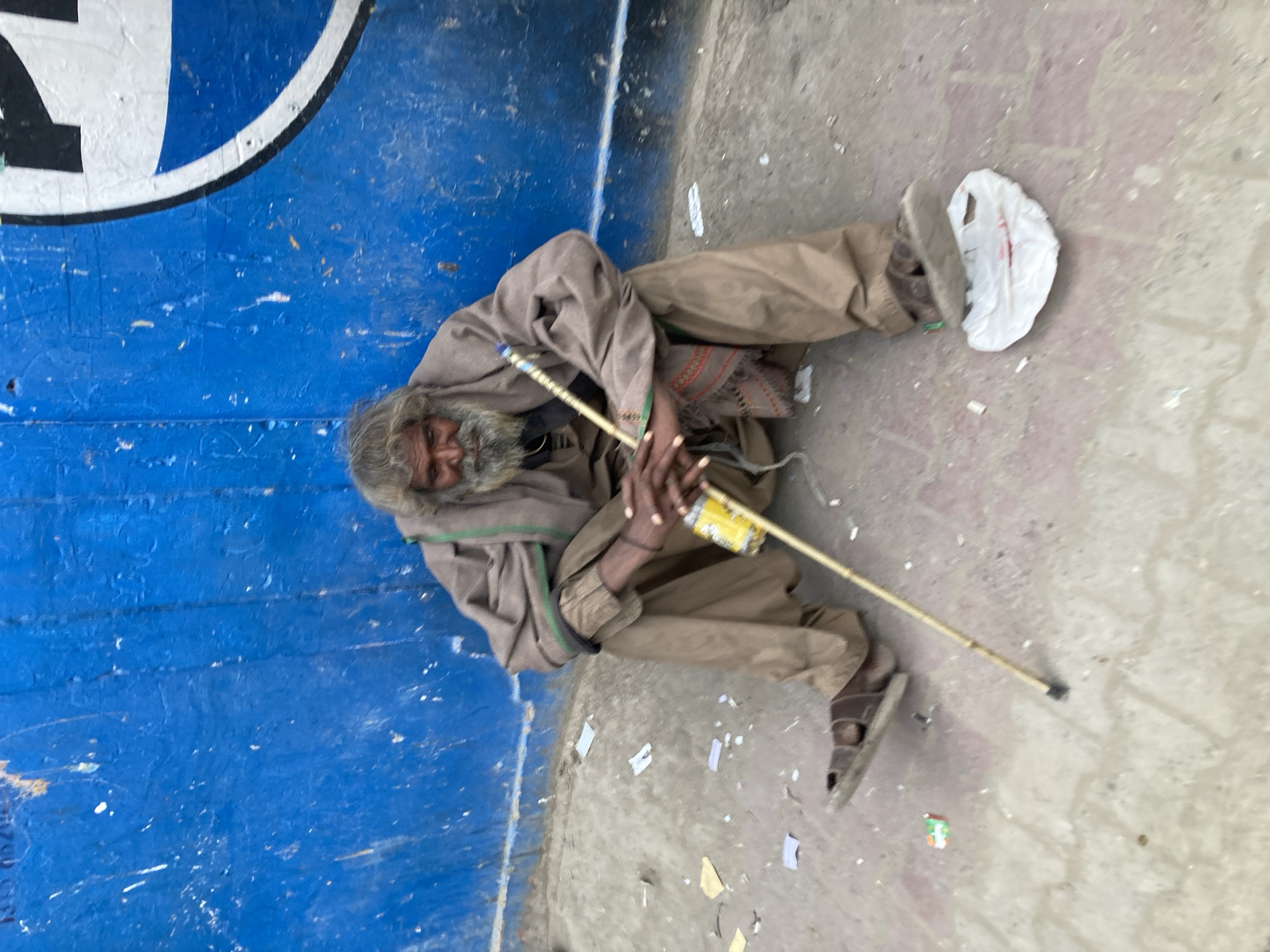 Street scenes captured in Quetta show cart puller, seated man