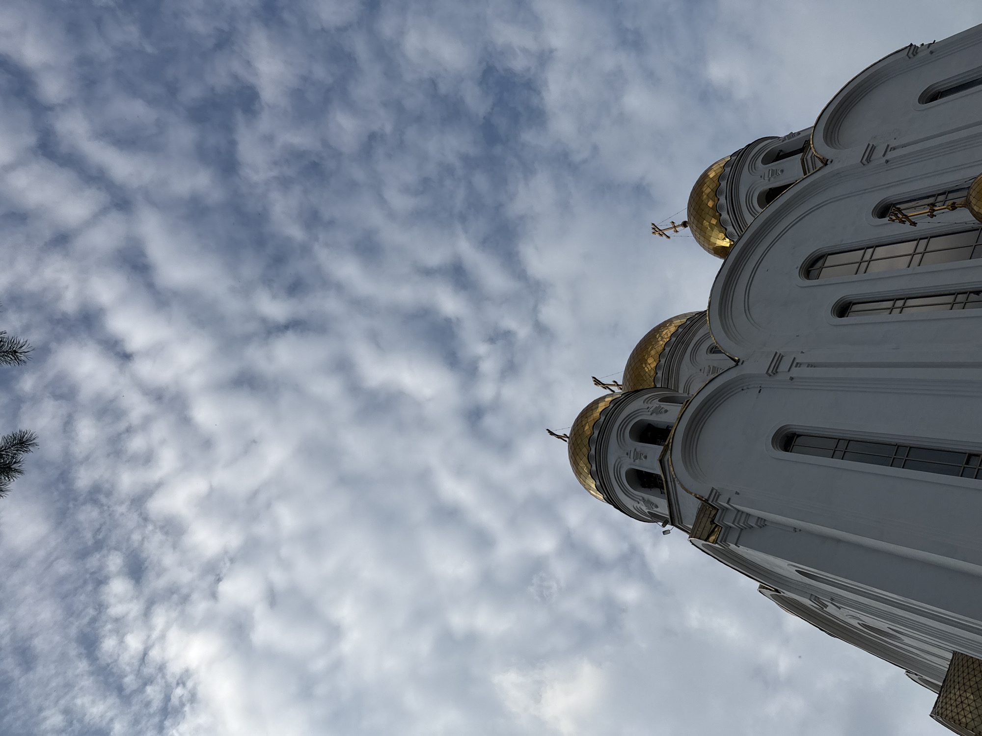 Golden domes, stormy skies, and a quiet bench in Russia