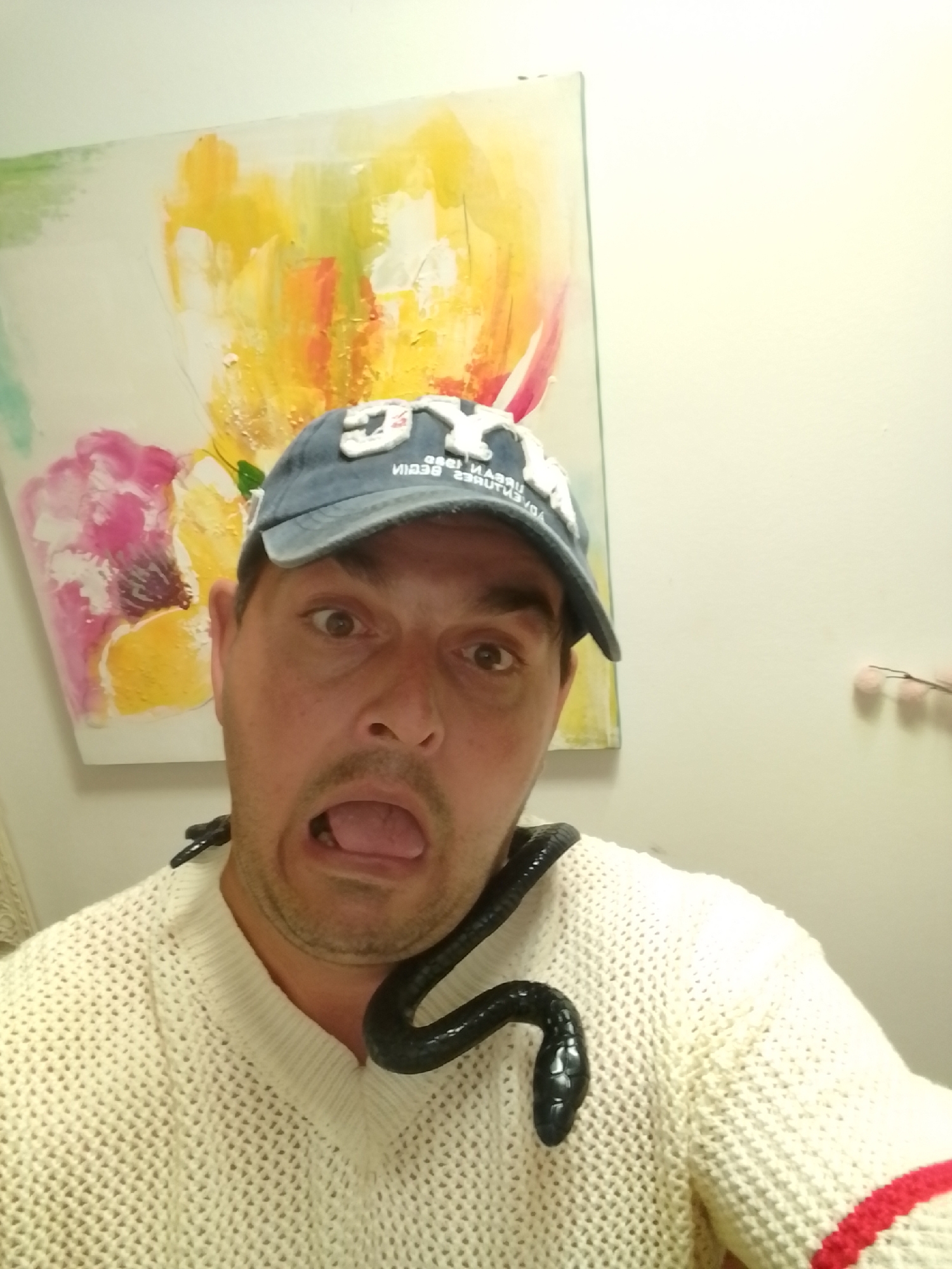 Playful indoor selfie session with snakes and shell props, Wedel