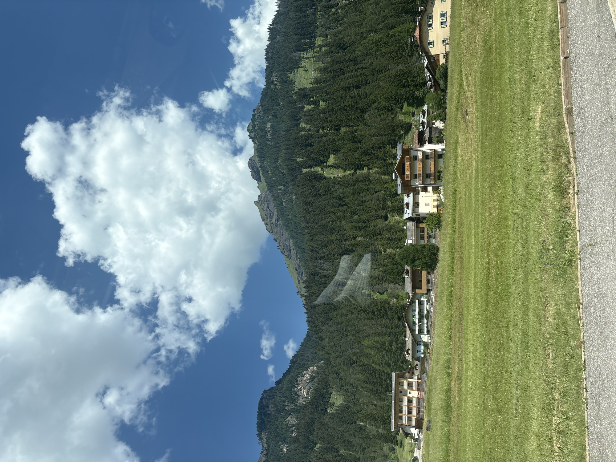 Cruising through an Alpine village on a clear summer morning