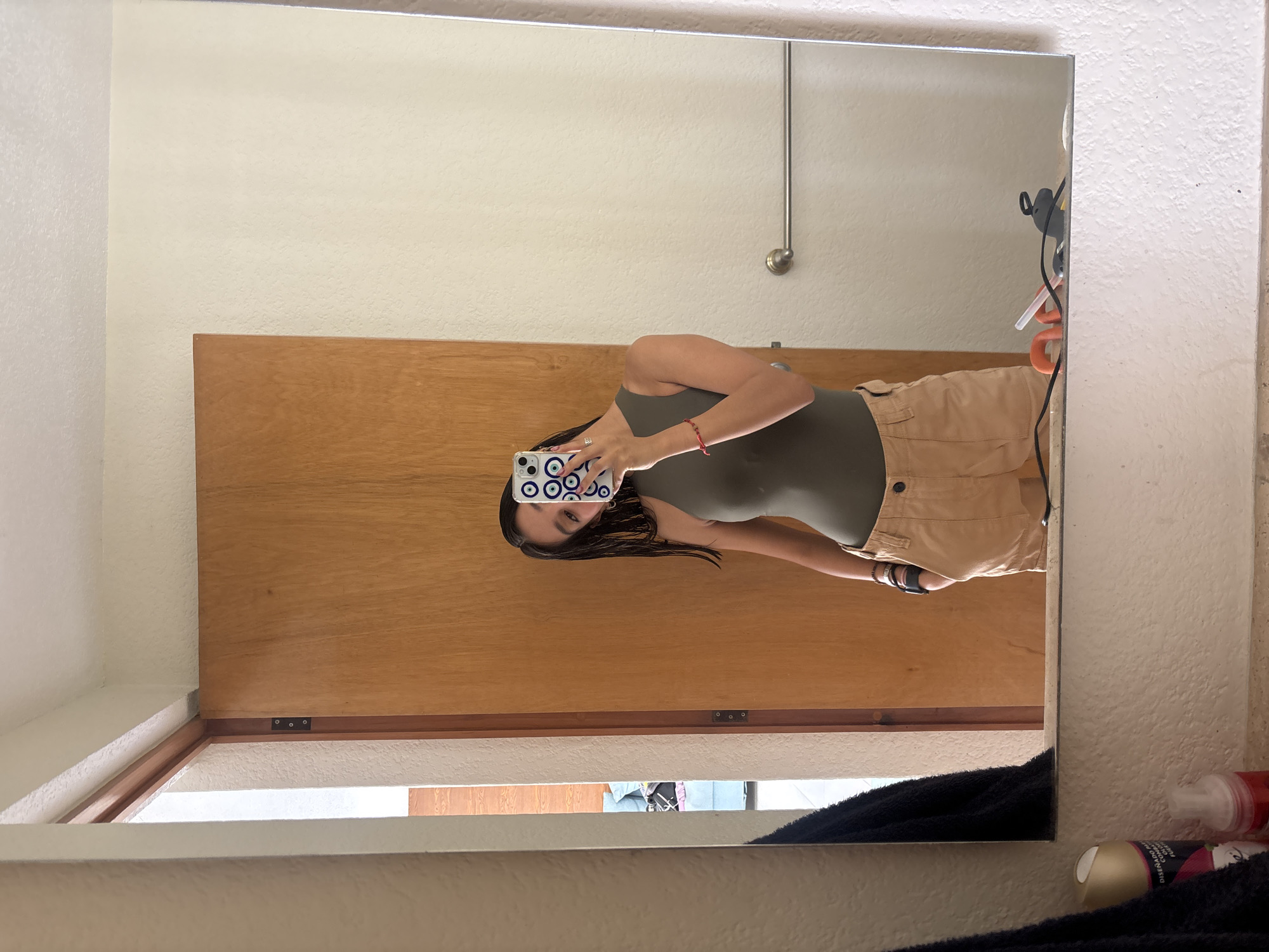 Person photographed in mirror reflection in Puebla home