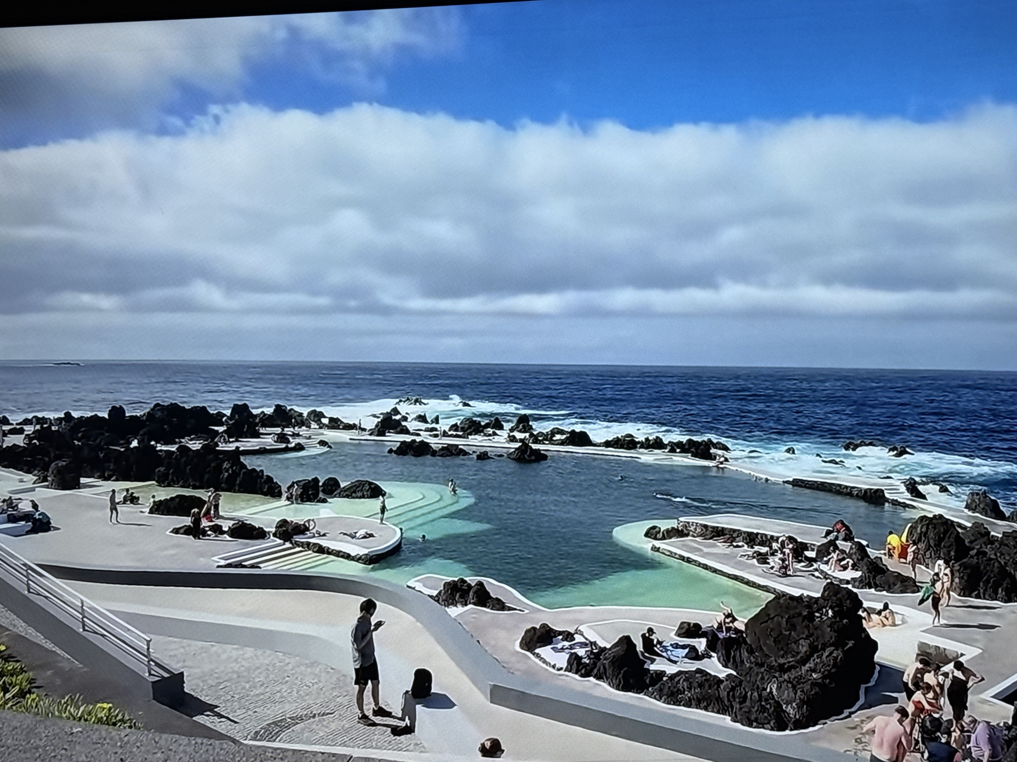 Coastal Madeira: cliffs, dark sand beach, and the Ronaldo Museum