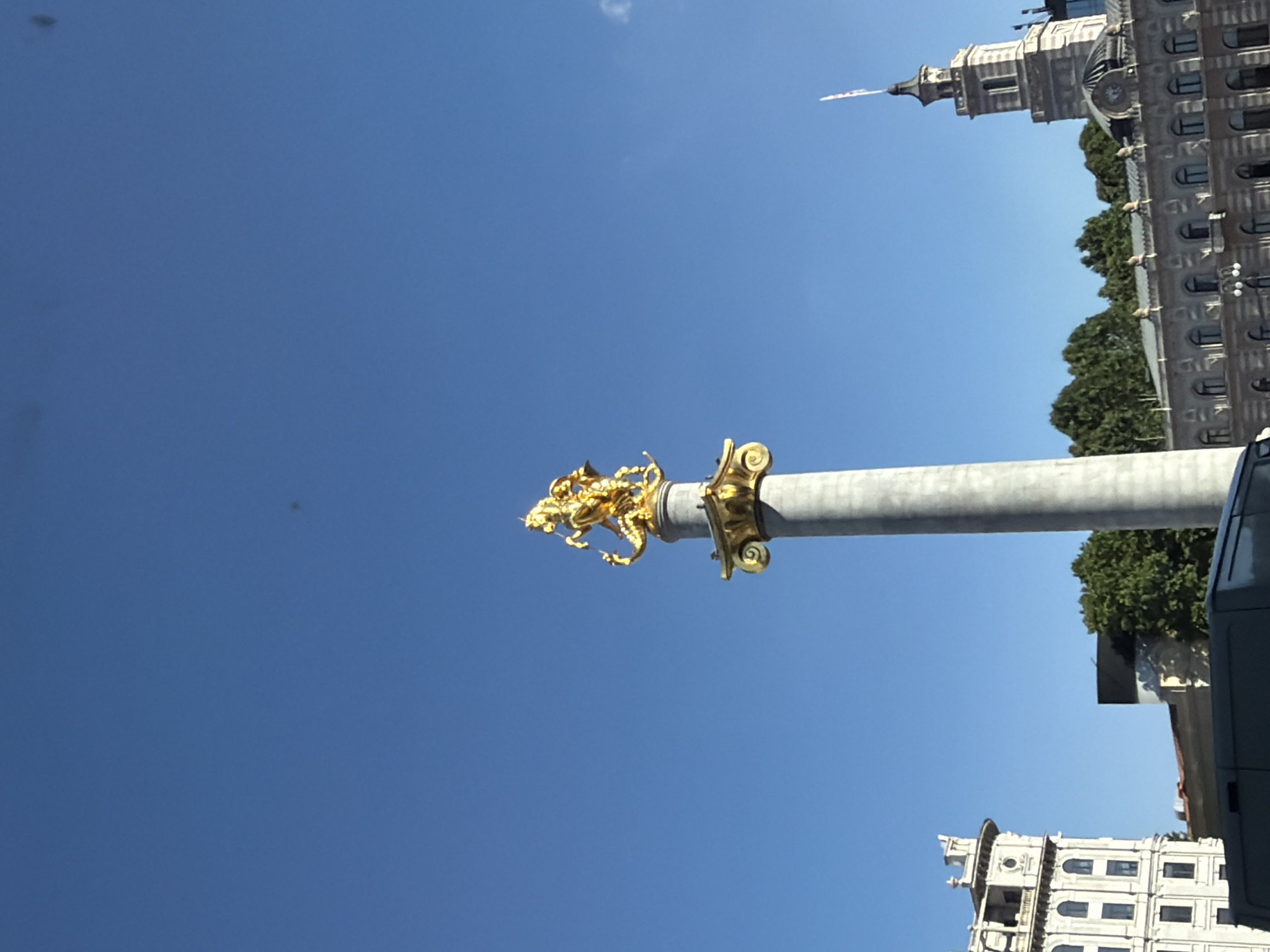 Tbilisi's Freedom Monument under a clear blue sky