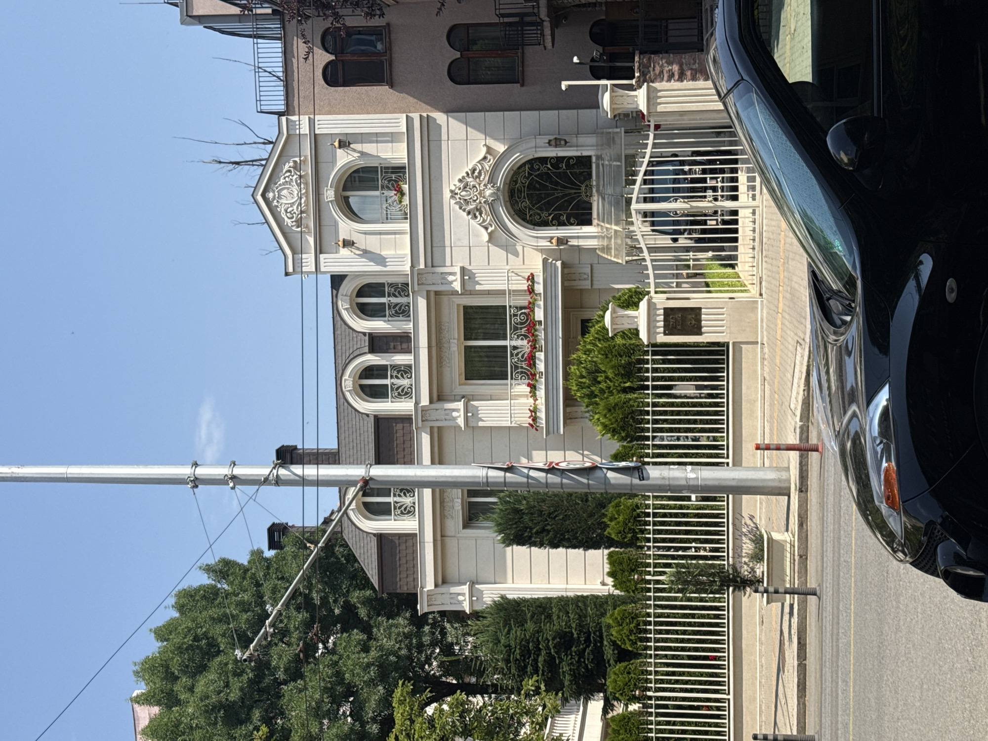 City street scenes: pedestrians, parked cars, and mixed architecture