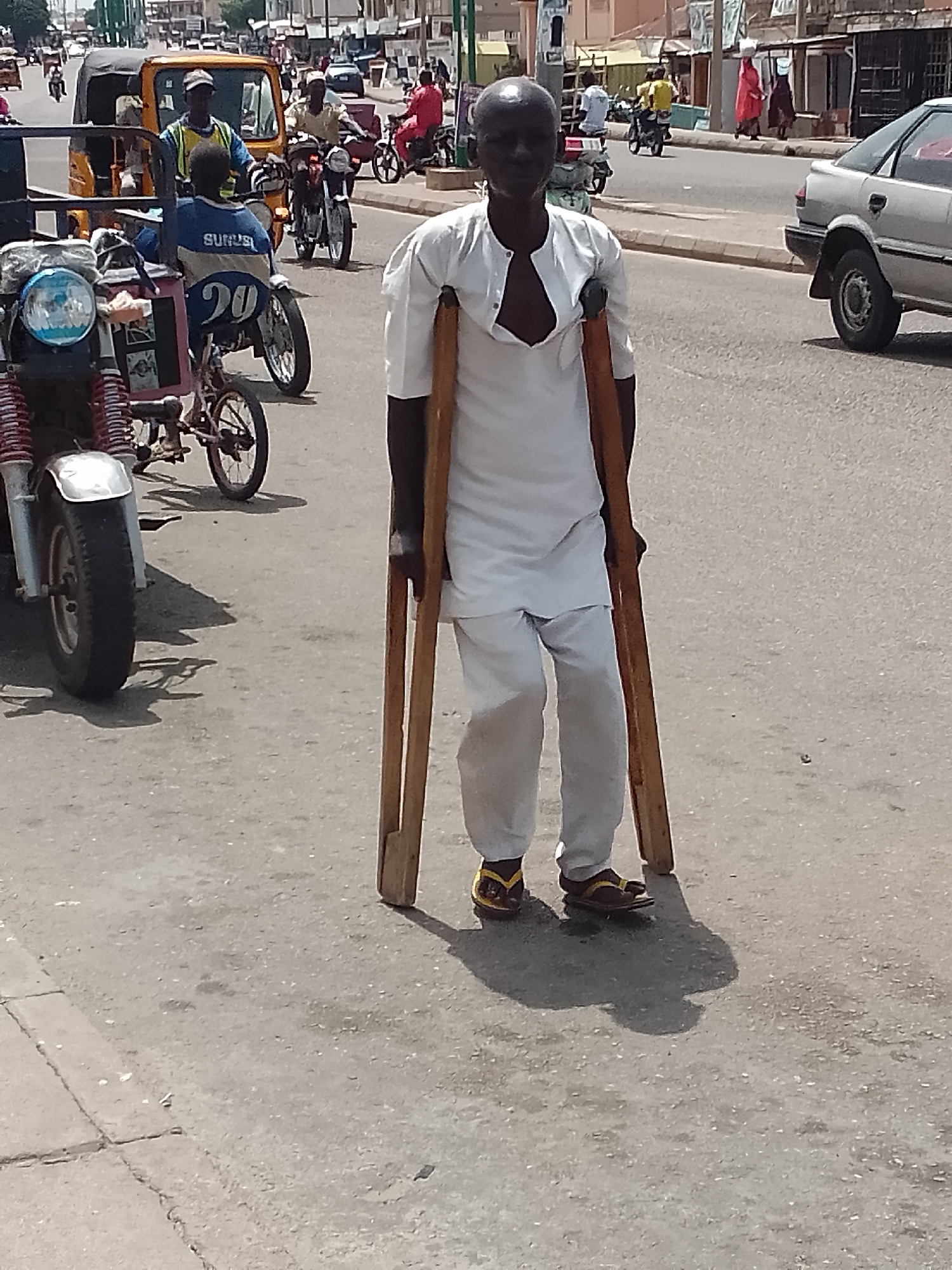 Daily street life documented in Nigerian towns during midday