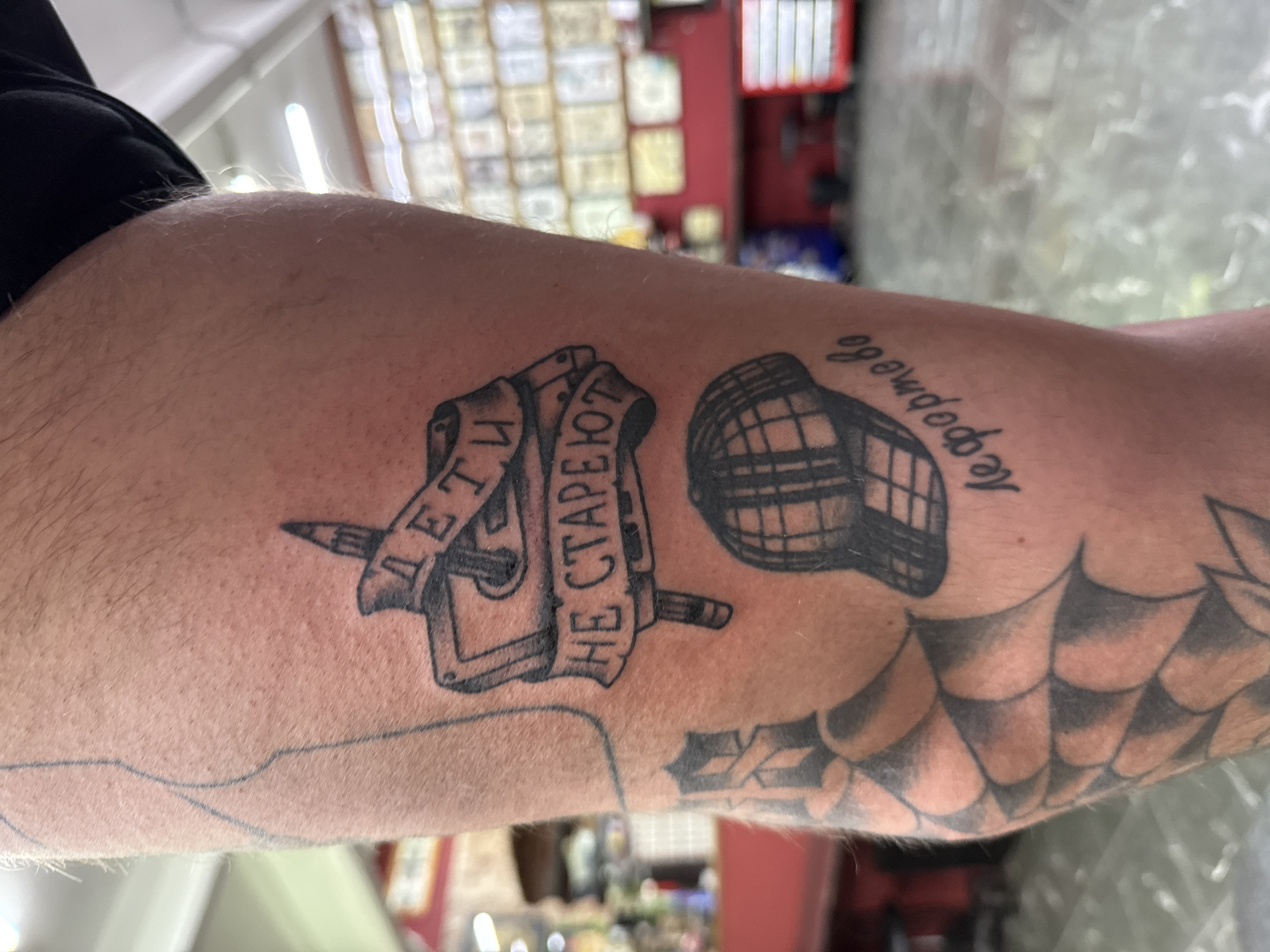Tattoo session documented in Moscow studio showcases multiple arm designs