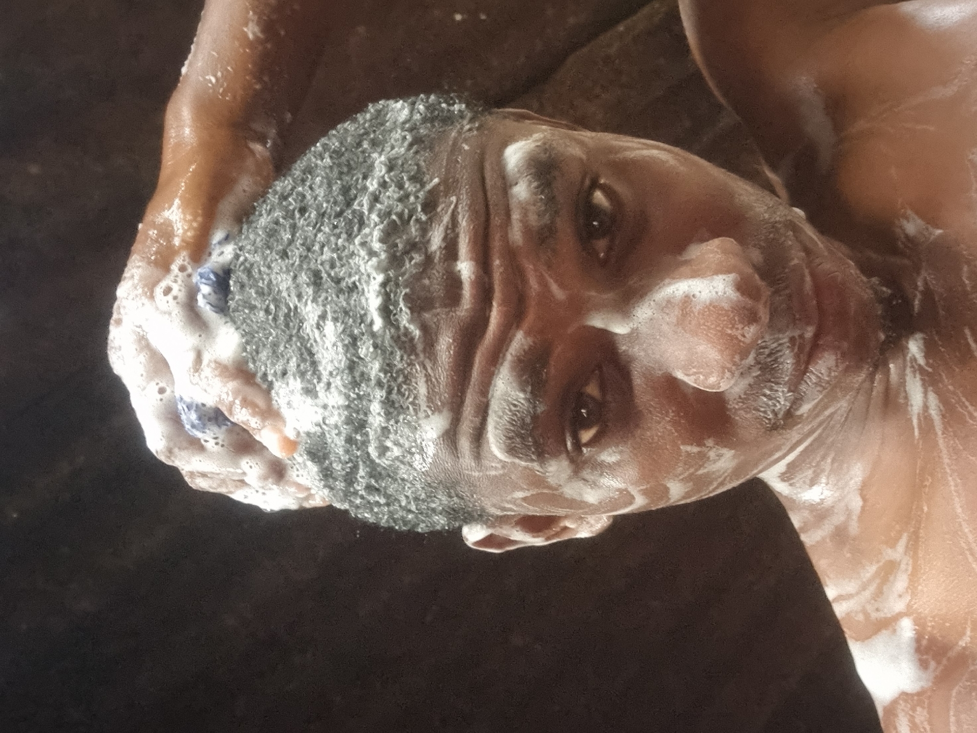 Man photographed washing with soap in Onitsha Nigeria