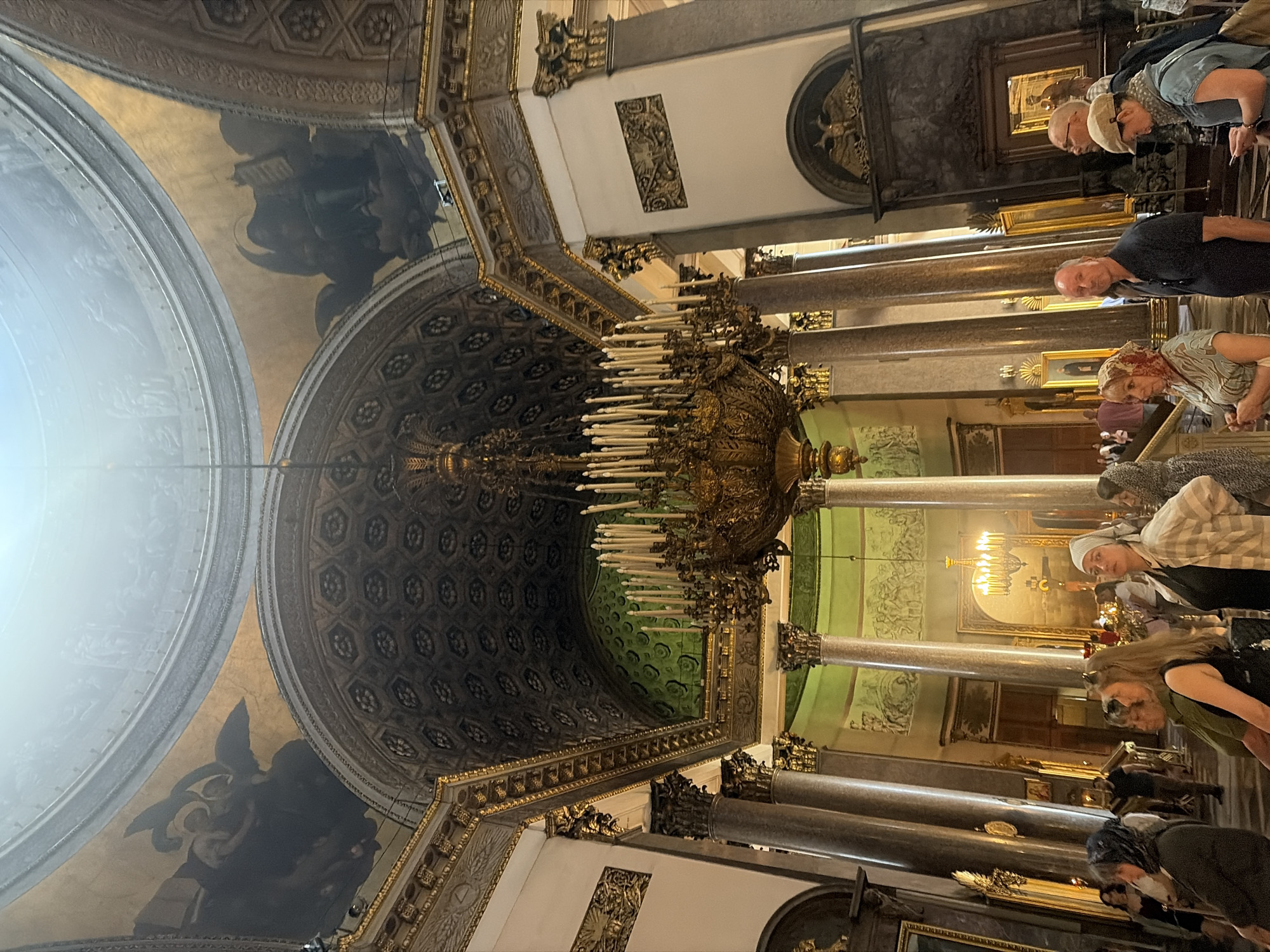 Inside an ornate cathedral, with a wizard outside