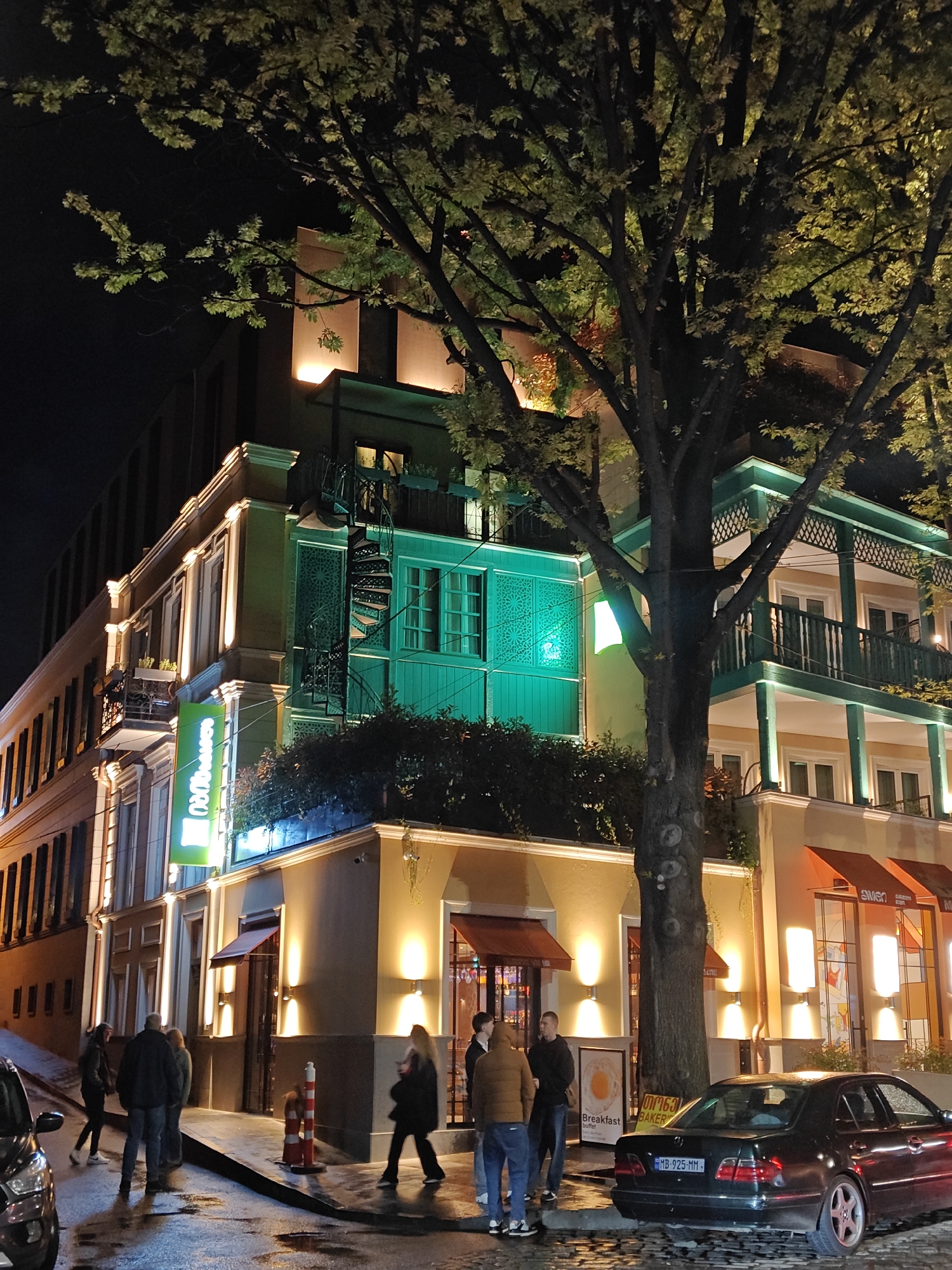 Evening street scenes captured in illuminated Tbilisi district