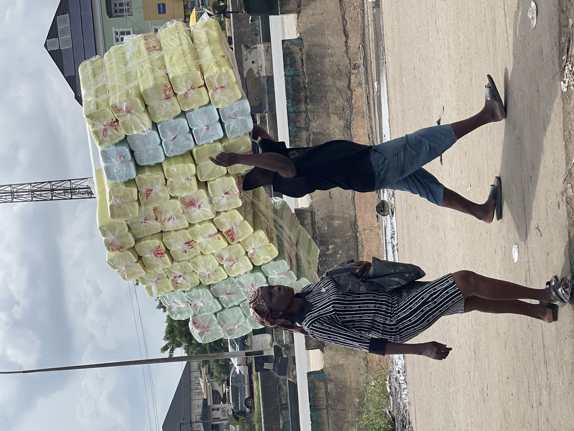 Urban marketplace activity documented during midday commercial hours