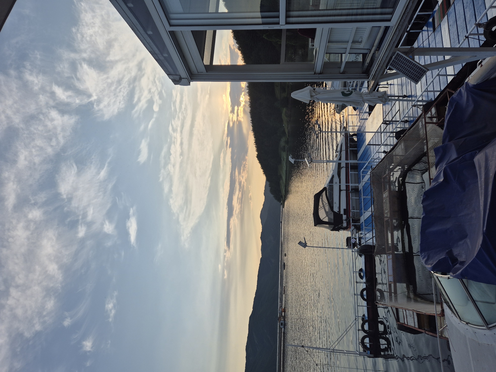 Sunset lakeside dining captured in Brosh, Bulgaria