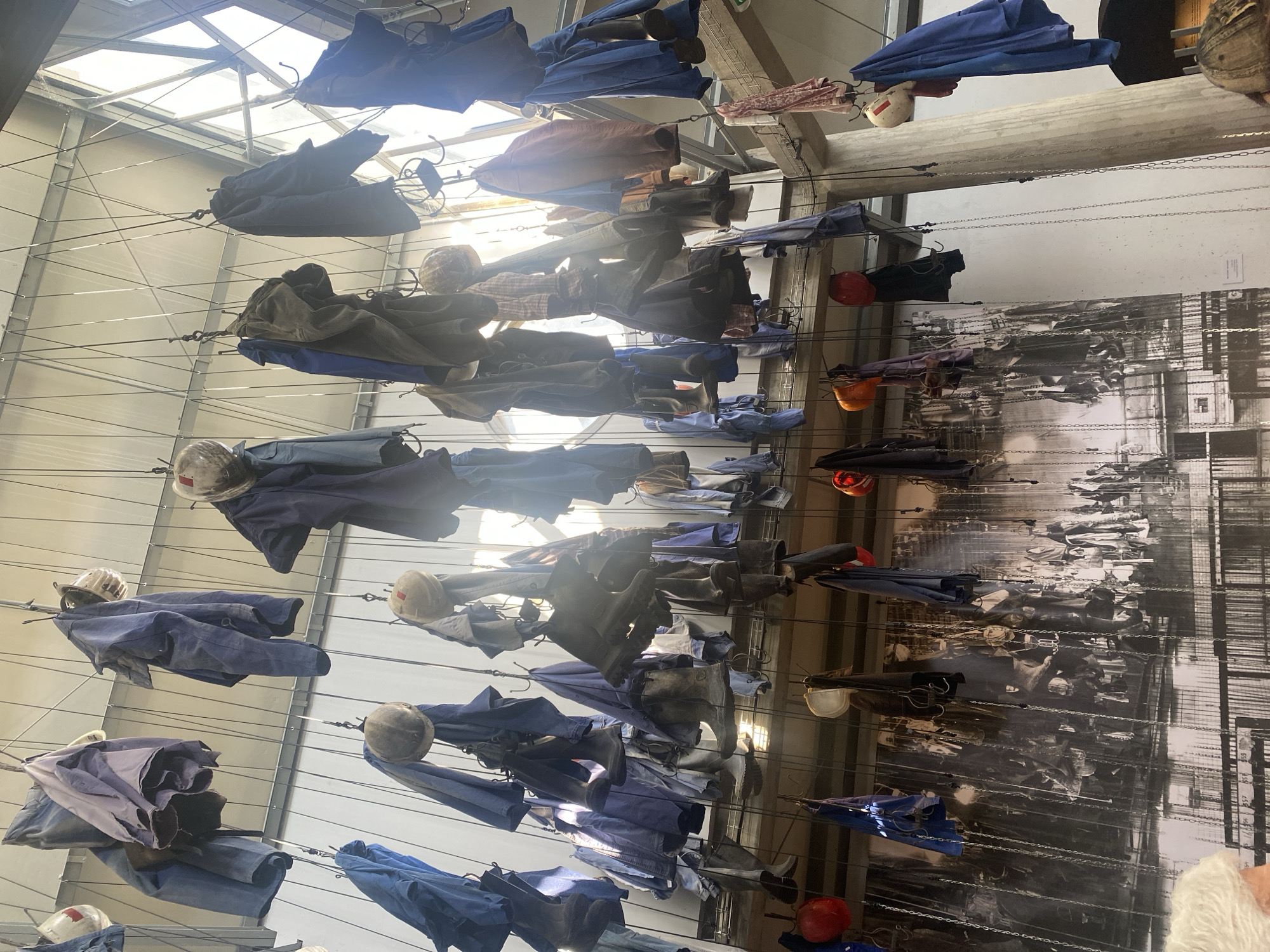 Mining heritage art installation displays suspended work clothes in France