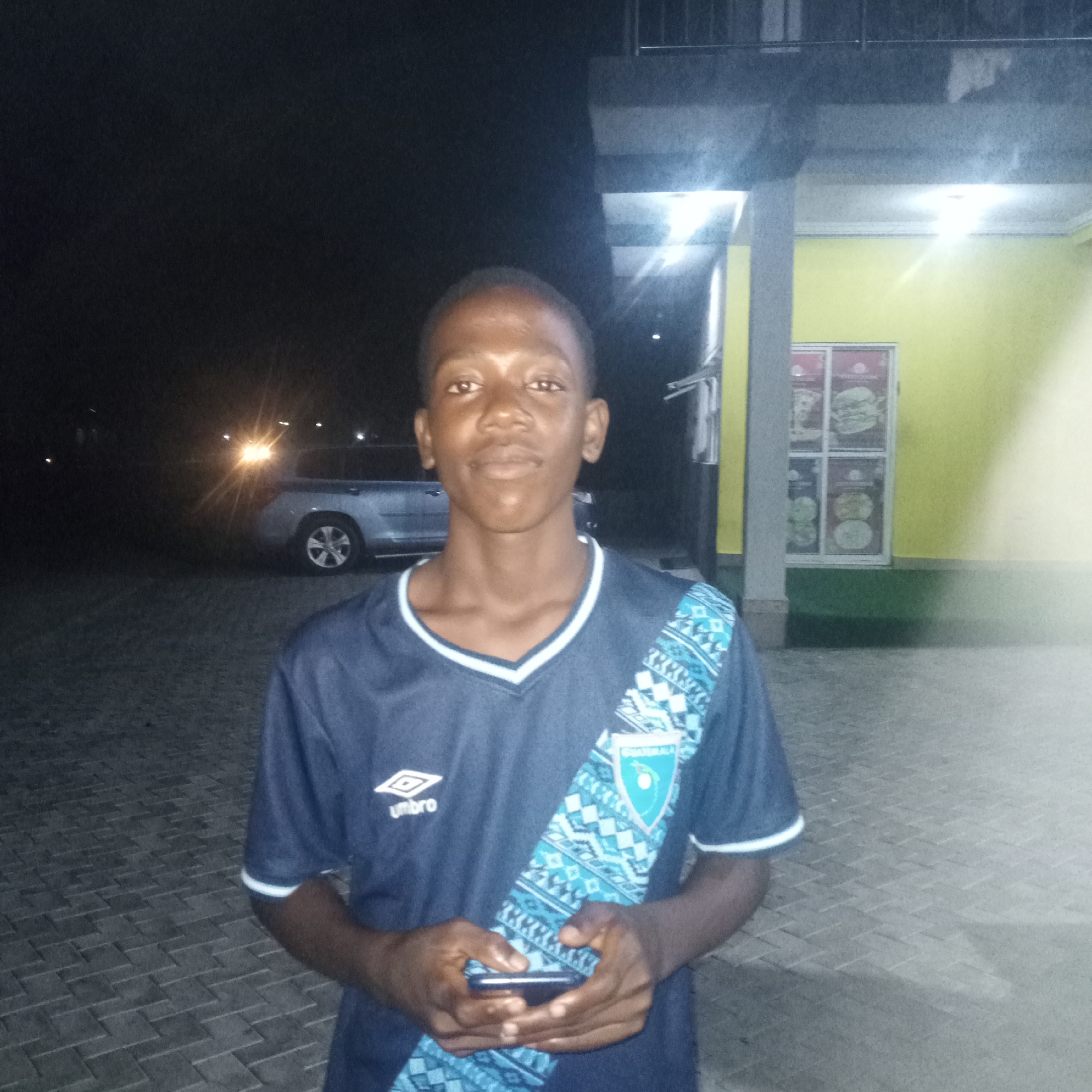 A quiet Nigerian evening: pool, speakers, and street scenes