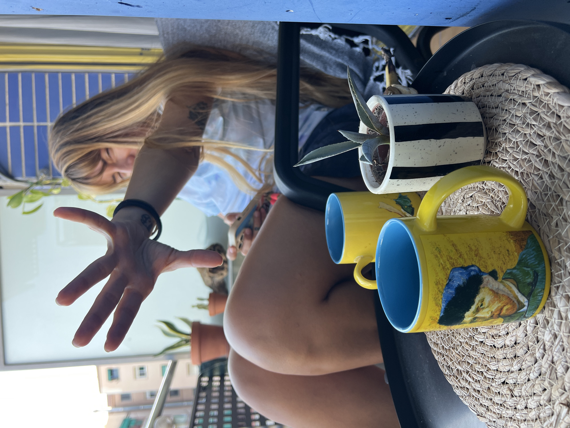 Slow morning on a Mollet del Vallès balcony with coffee mugs