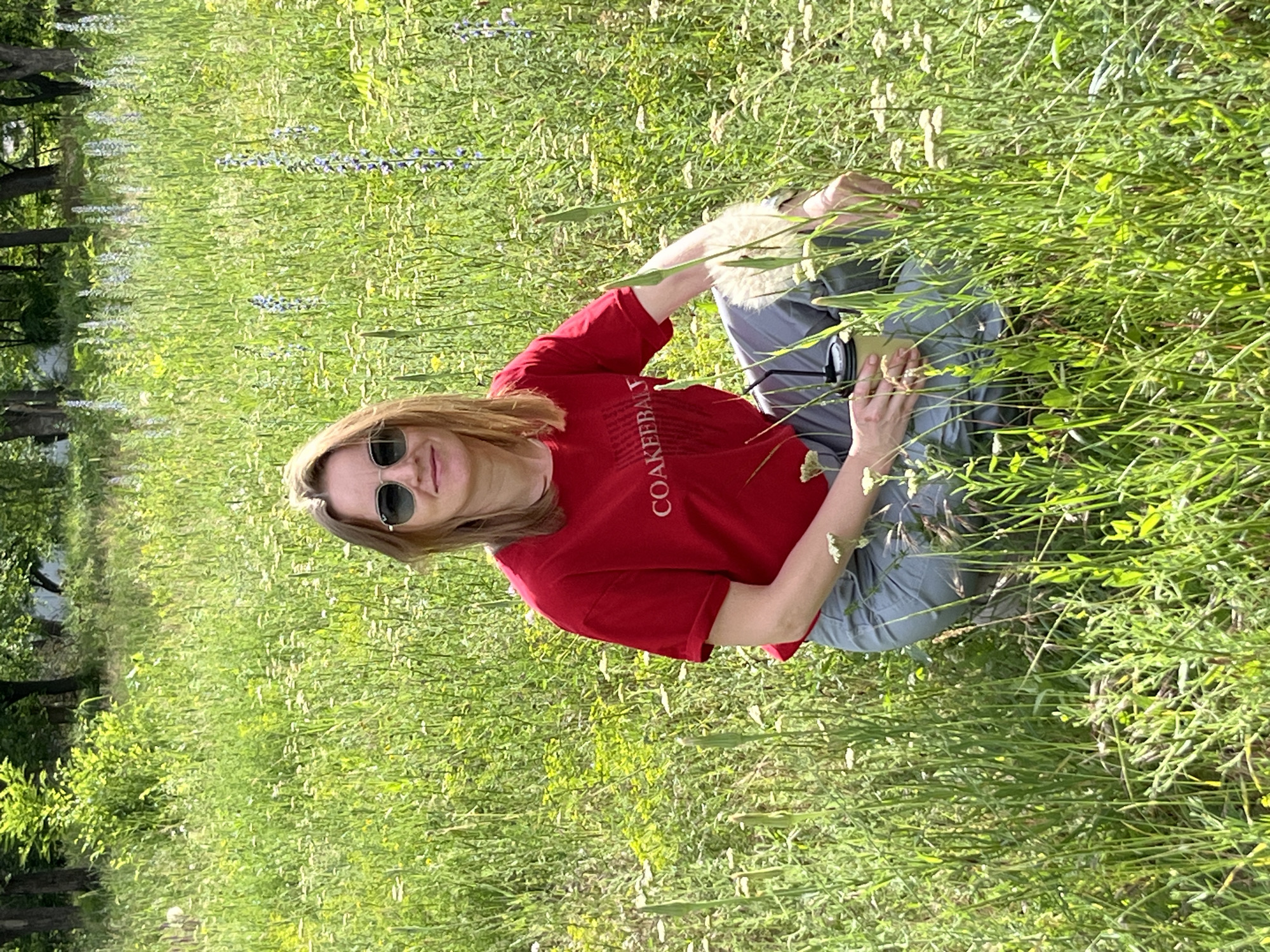 Woman enjoys coffee break in wildflower field near Kryvyi Rih