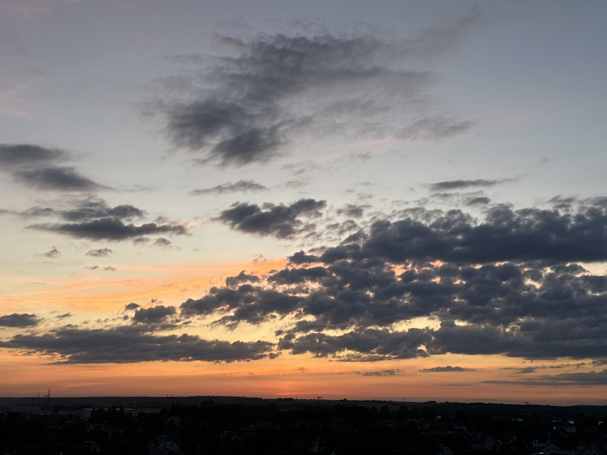 Sunset spreads across the rural outskirts of Minsk region