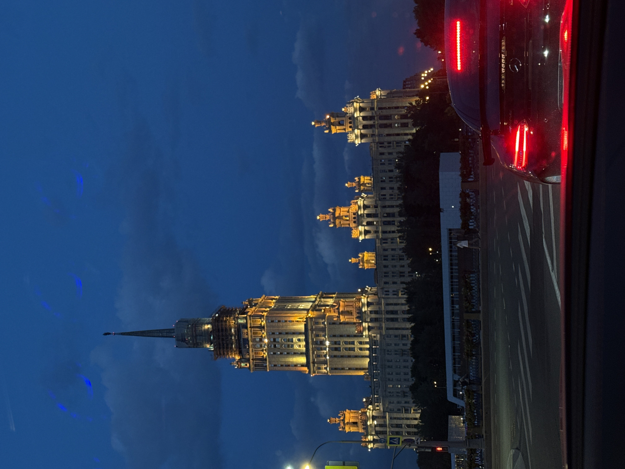 Moscow's iconic Stalinist skyscraper illuminated against evening sky