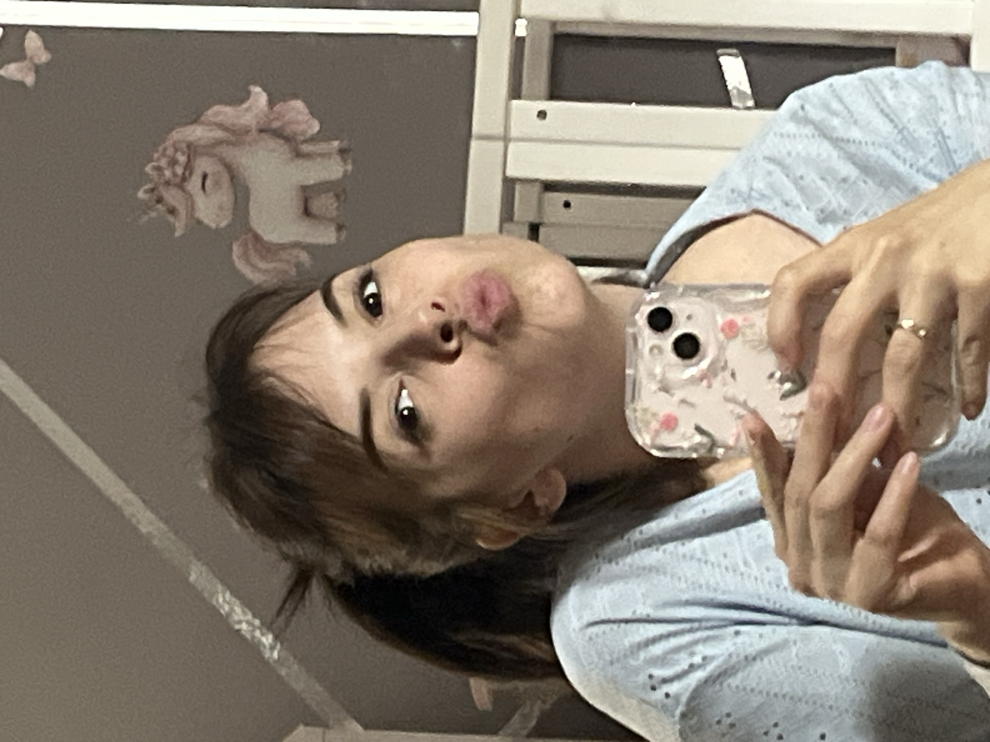 Person takes casual selfies in Shushary, Russia bedroom